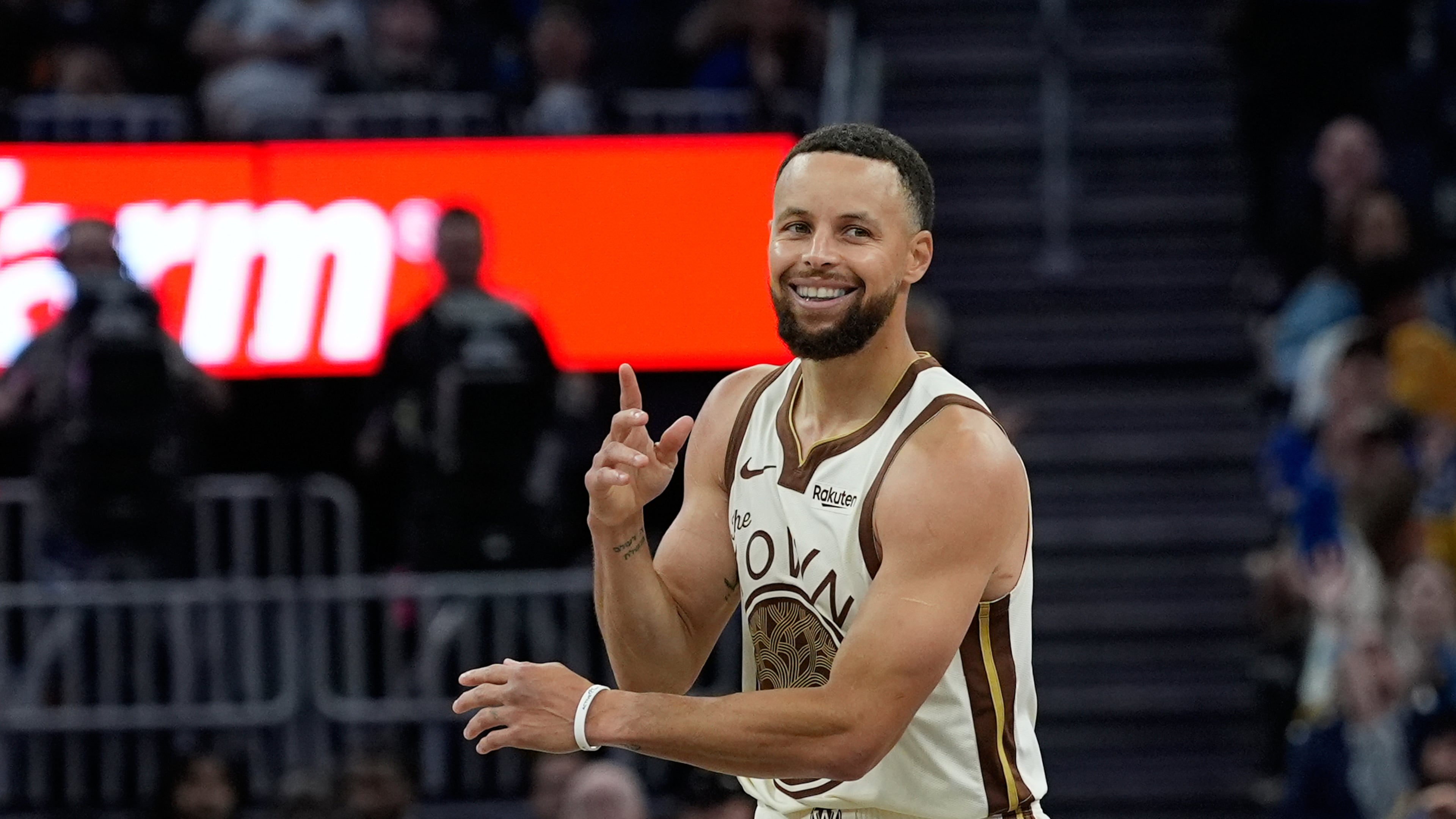 FILE - Golden State Warriors guard Stephen Curry reacts after making a 3-point basket during the second half of an NBA basketball game against the Sacramento Kings, Tuesday, April 7, 2026, in San Francisco. (AP Photo/Godofredo A. Vásquez, File)