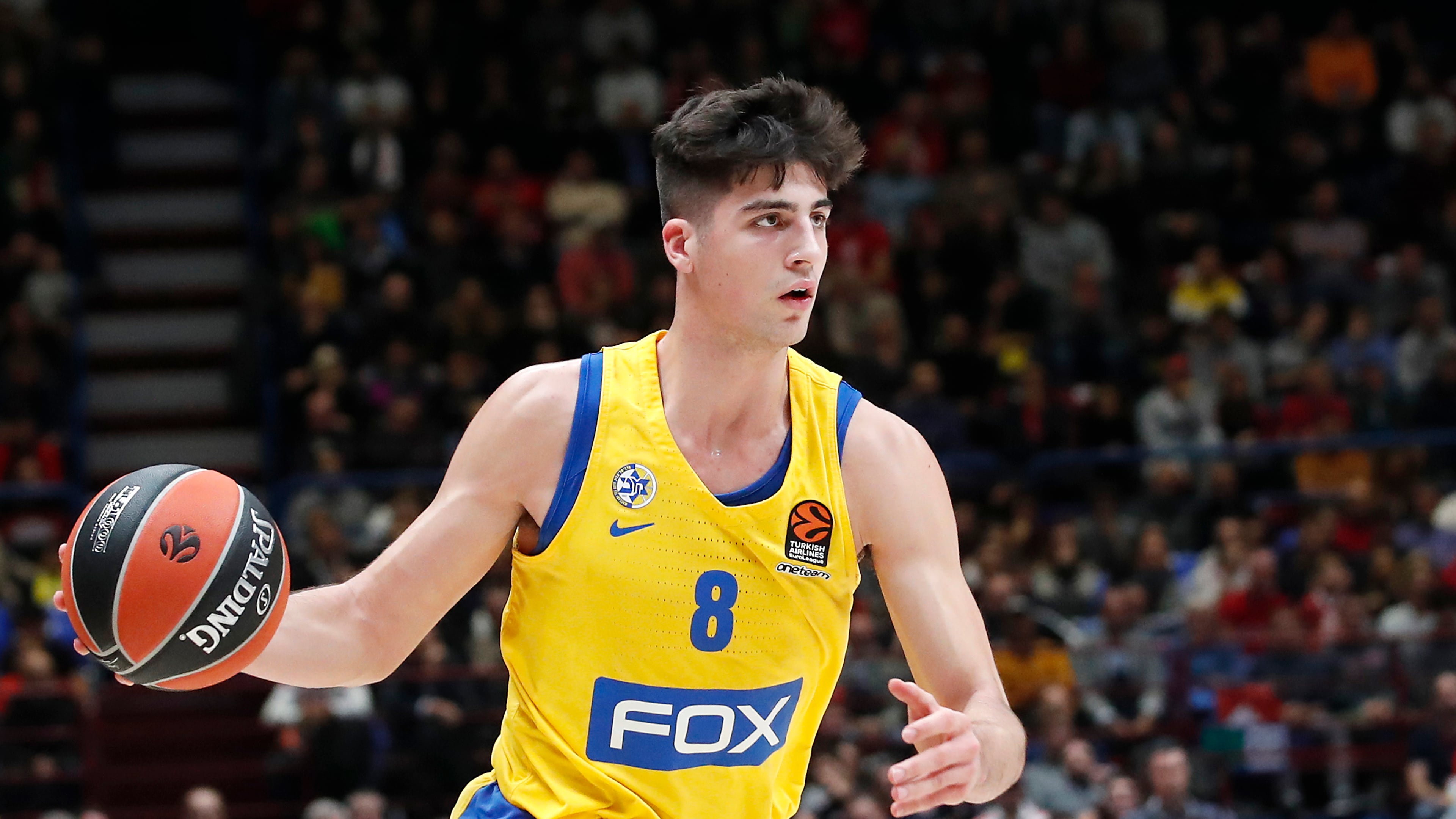 Maccabi Fox Tel Aviv's Deni Avdija controls the ball during the Euro League basketball match between Olimpia Milan and Maccabi Fox Tel Aviv, in Milan, Italy, Tuesday, Nov. 19, 2019. (AP Photo/Antonio Calanni)