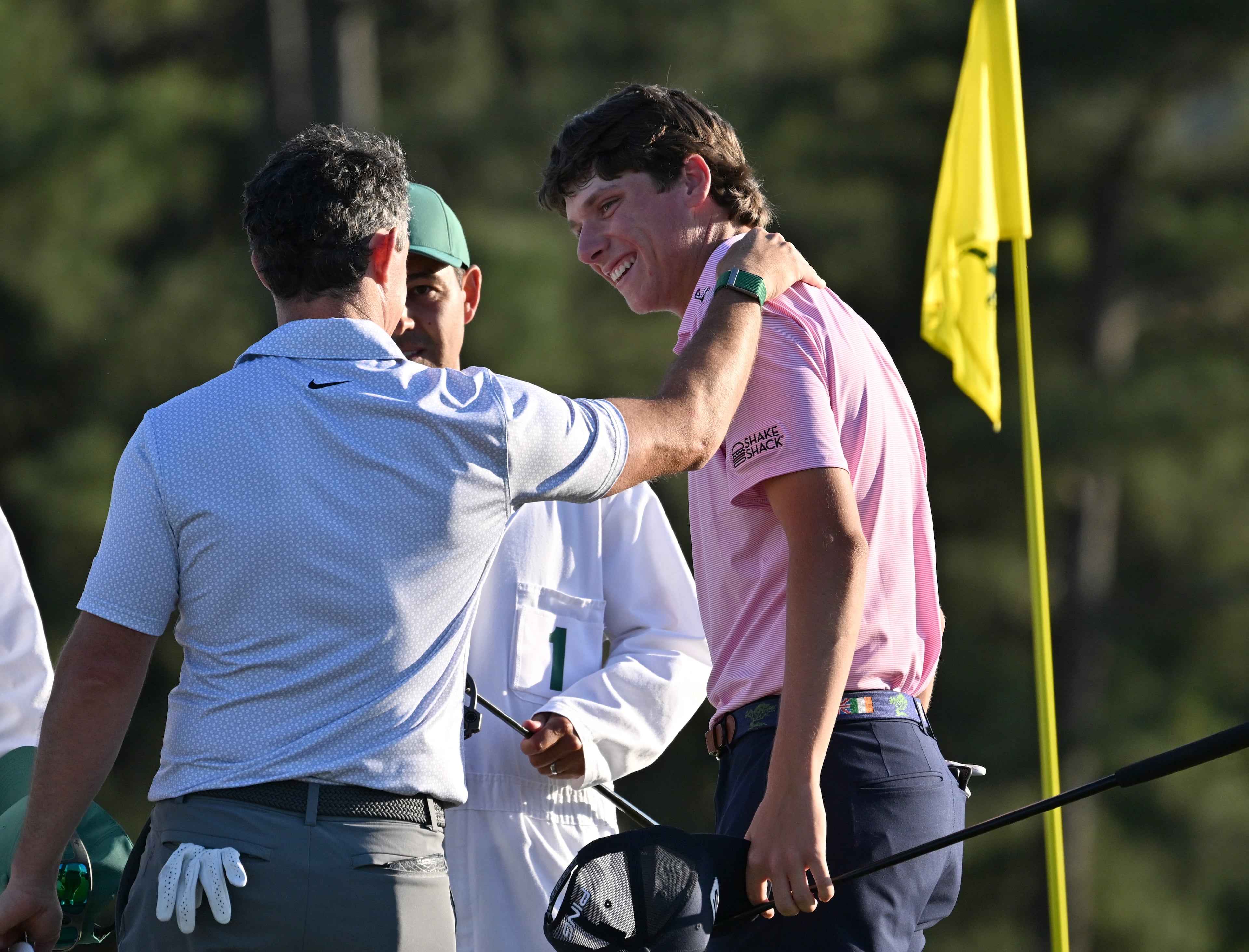 Rory McIlroy and Mason Howell talk at the end of their second round of the Masters, at Augusta National Golf Club, Friday, April 10, 2026, in Augusta, Ga. (Hyosub Shin/AJC)