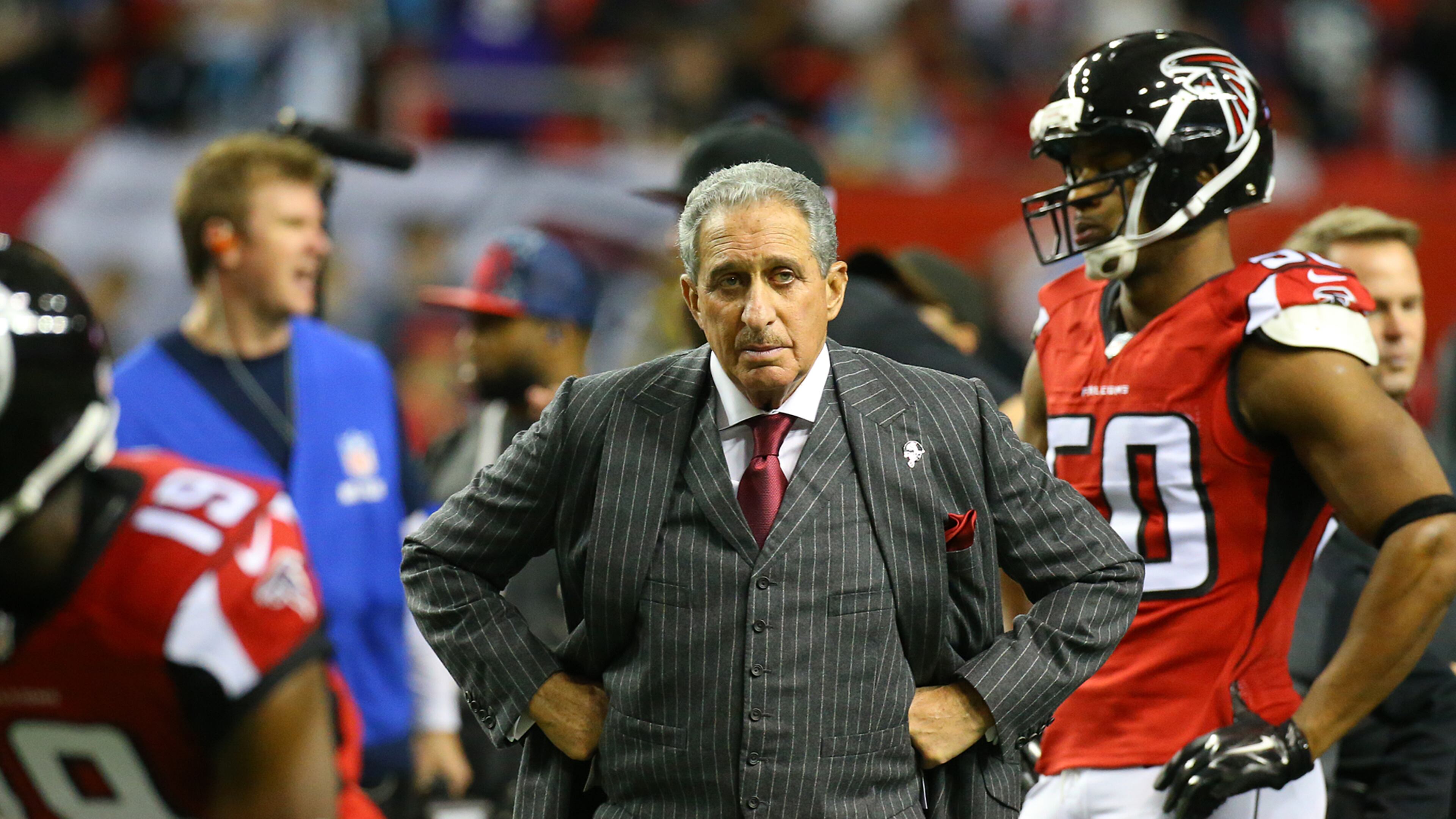 122814 ATLANTA: Falcons owner Arthur Blank prowls the field as his team prepares to face the Panthers for the NFC South title in a football game on Sunday, Dec. 28, 2014, in Atlanta. Curtis Compton / ccompton@ajc.com