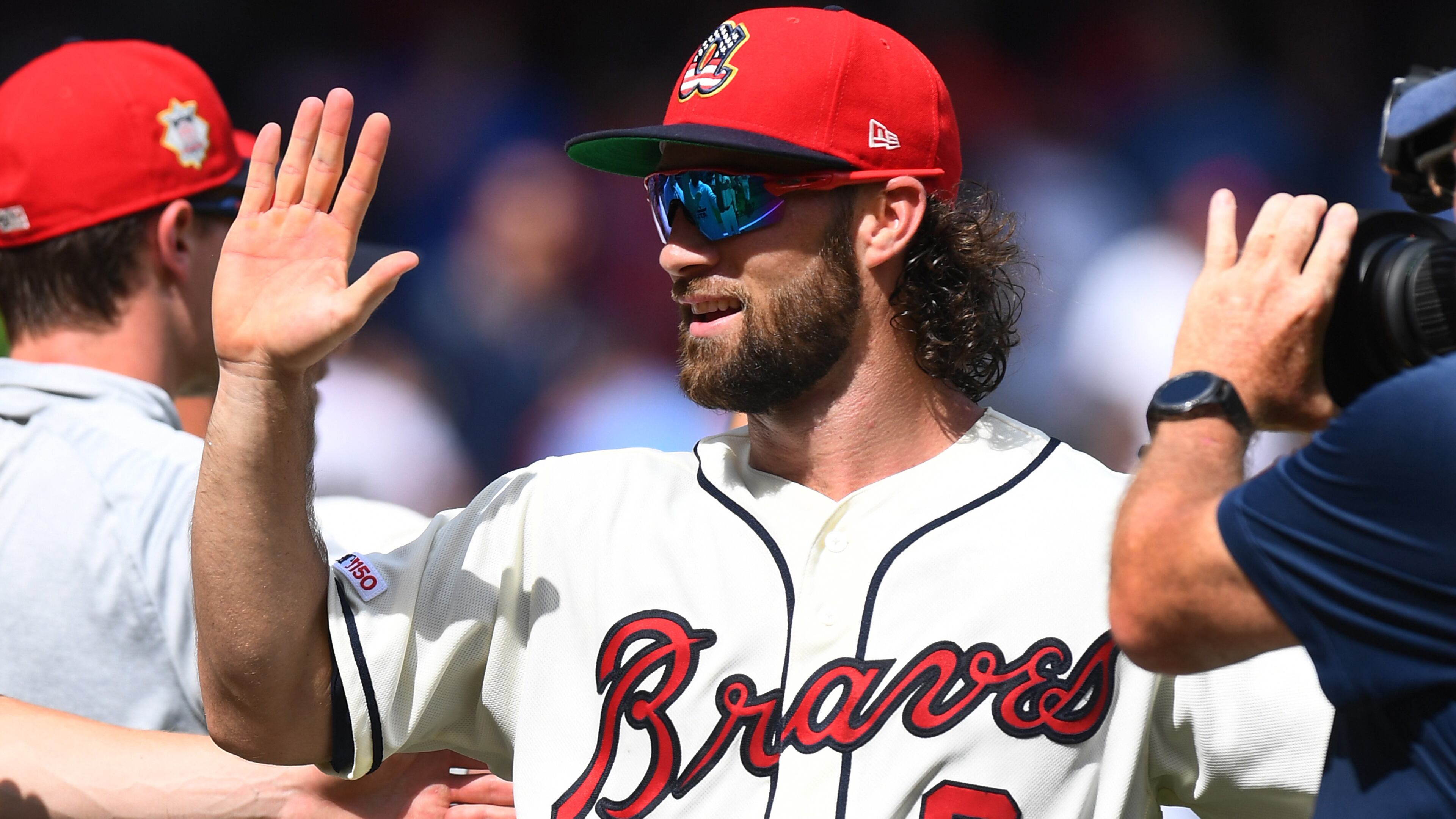 Braves' Charlie Culberson celebrates with teammates after the win Sunday, July 7, 2019, against the Miami Marlins at SunTrust Park in Atlanta.