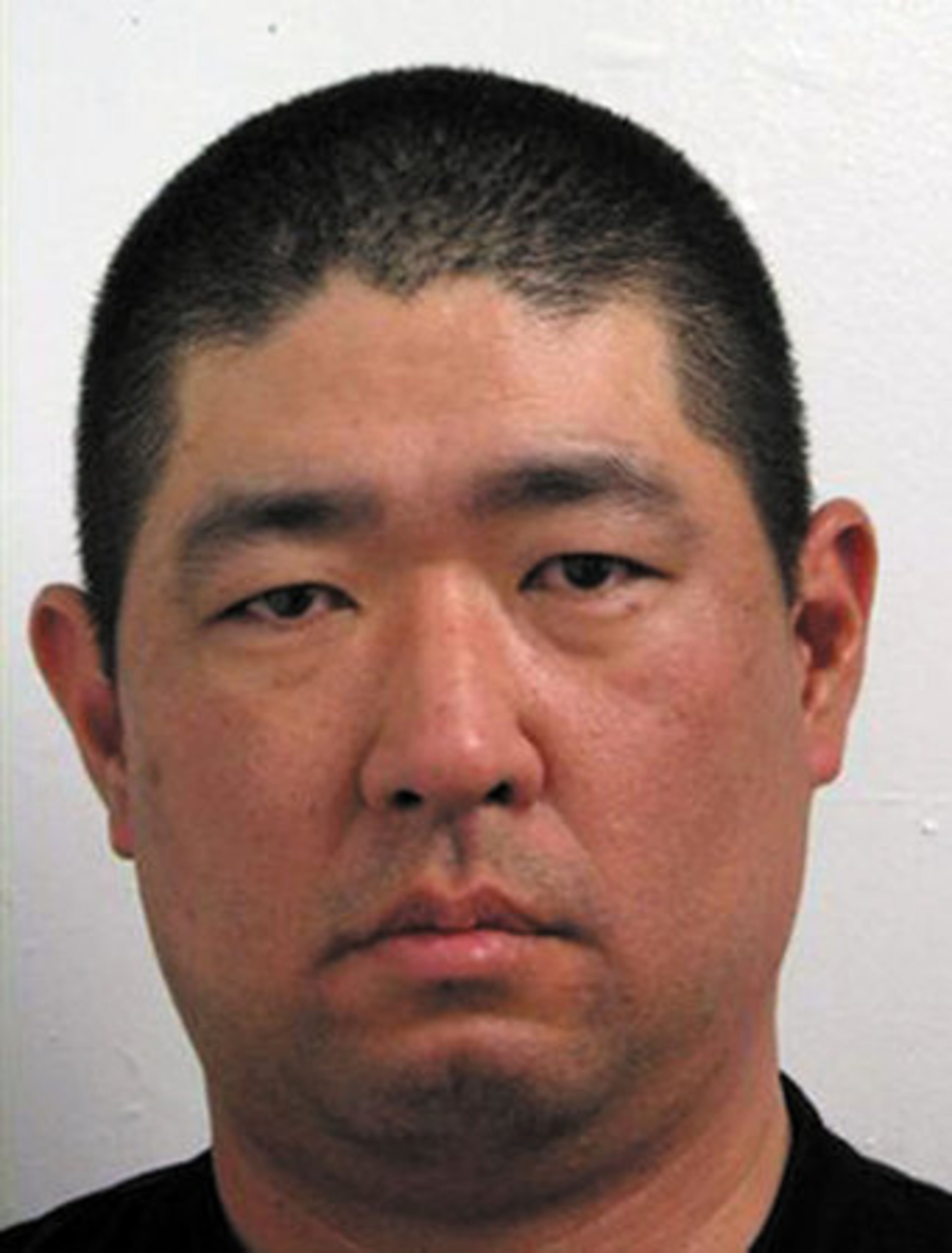 James J. Lee, seen is a booking mugshot from 2008 on disorderly conduct, is suspected in the raid. Police said he was waved a gun and had several metal canisters strapped to his body.