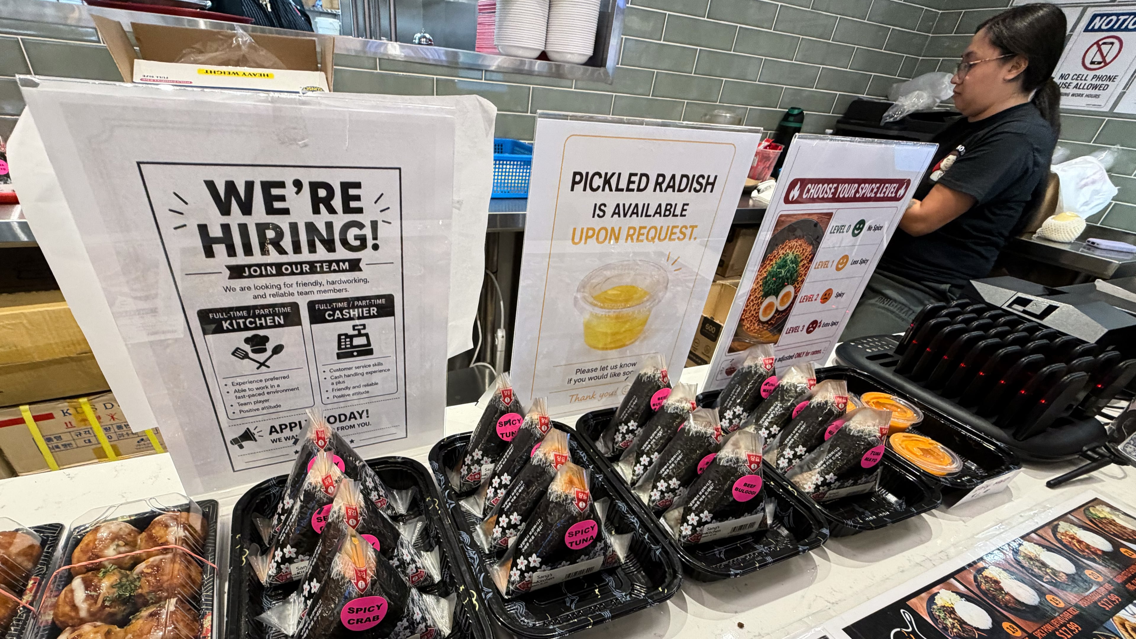 A hiring sign is displayed at a food court in a grocery store, in Schaumburg, Ill., Wednesday, Sept. 16, 2026. (AP Photo/Nam Y. Huh)