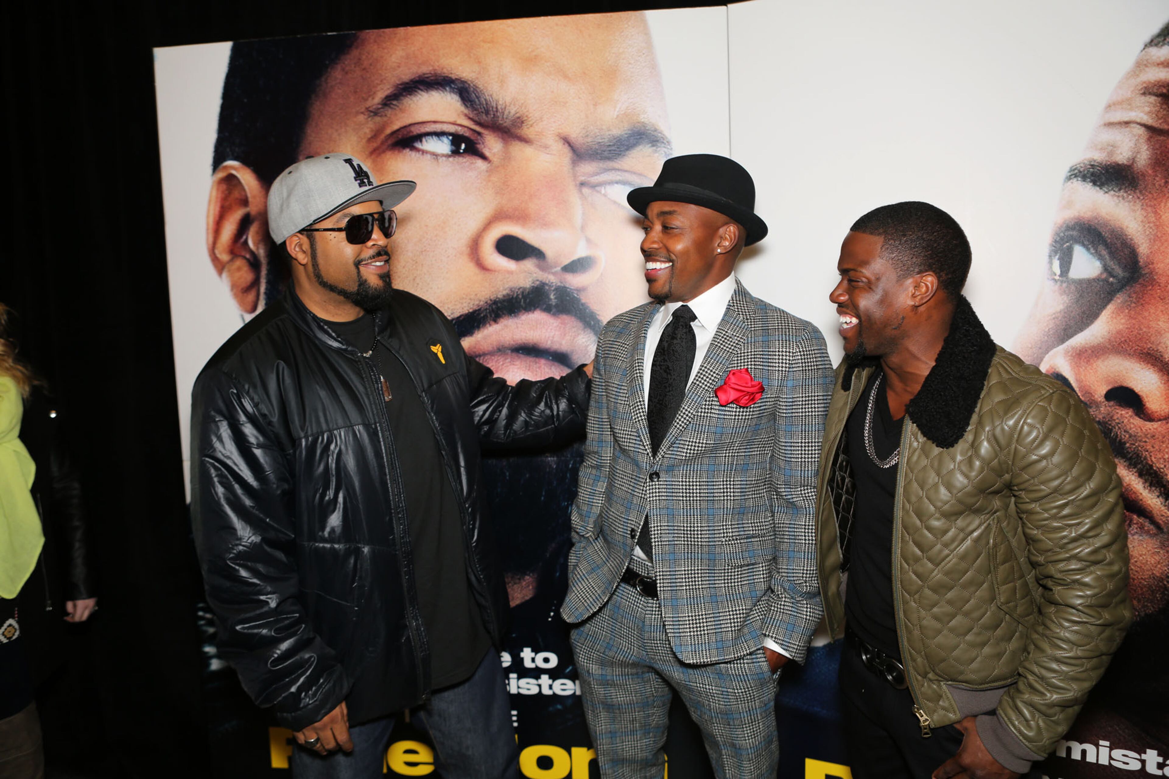 Ice Cube, left, and Kevin Hart, right, pose on the red carpet for the premier of comedy action film "Ride Along," at the Atlantic Station Regal Theater in Atlanta Monday, Jan. 6, 2014.
