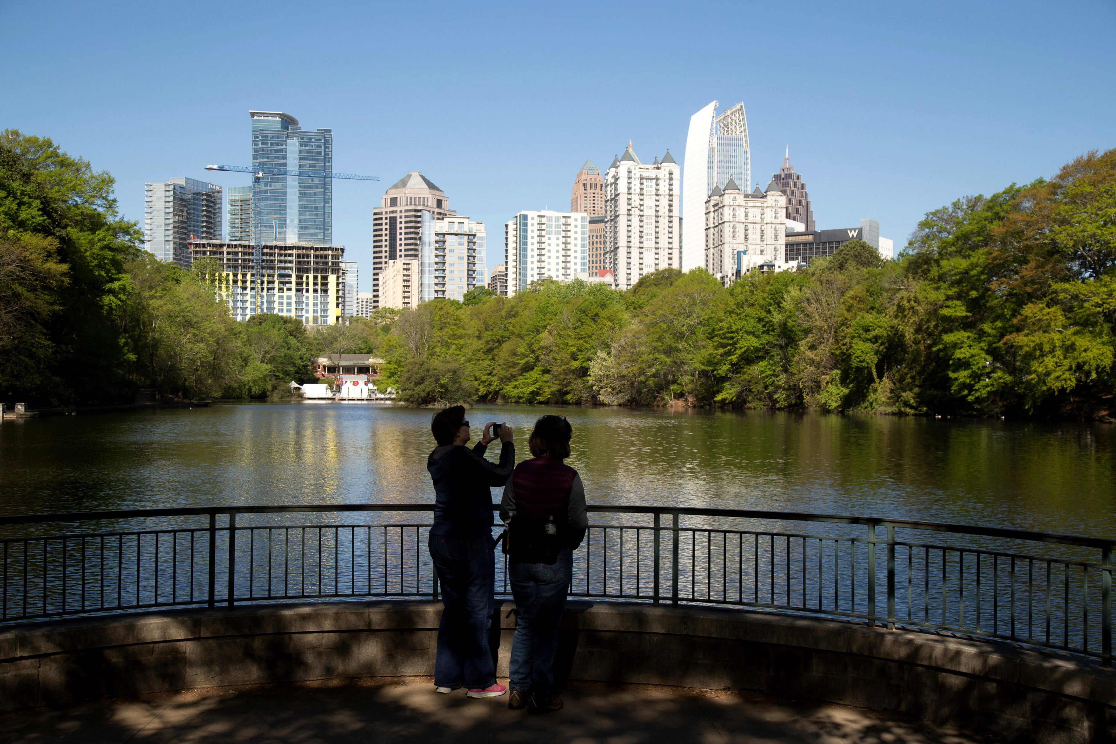 Bonnie Shields (L) and Julie Fish take a moment to photograph the skyline during the 81st Annual Atlanta Dogwood Festival early Saturday in Atlanta, Ga April 8, 2017. STEVE SCHAEFER / SPECIAL TO THE AJC