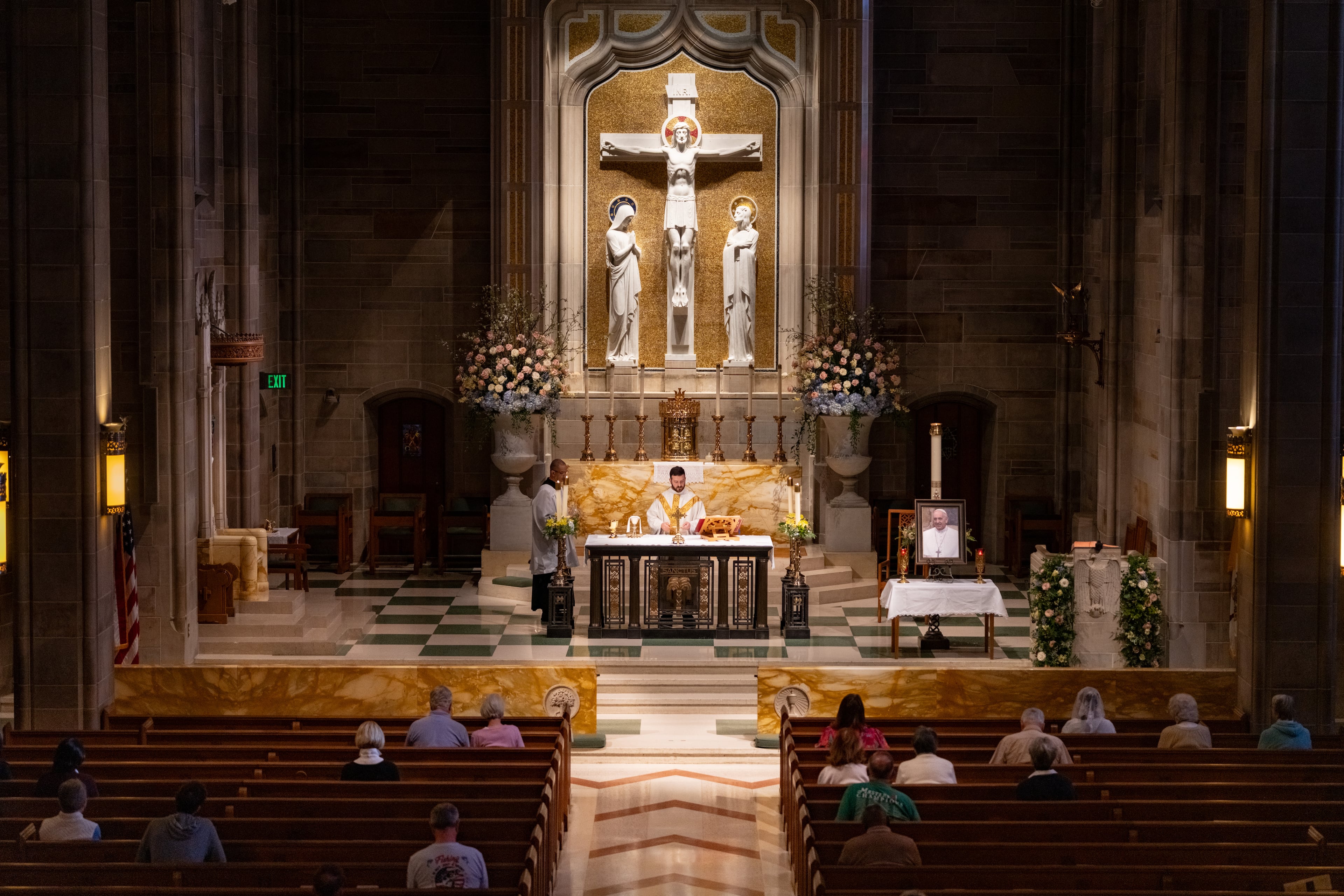 Pope Francis' portrait sits on a table next to the altar during morning Mass at Cathedral of Christ the King Catholic Church in Atlanta, Monday, April 21, 2025 (Ben Hendren for The Atlanta Journal-Constitution)