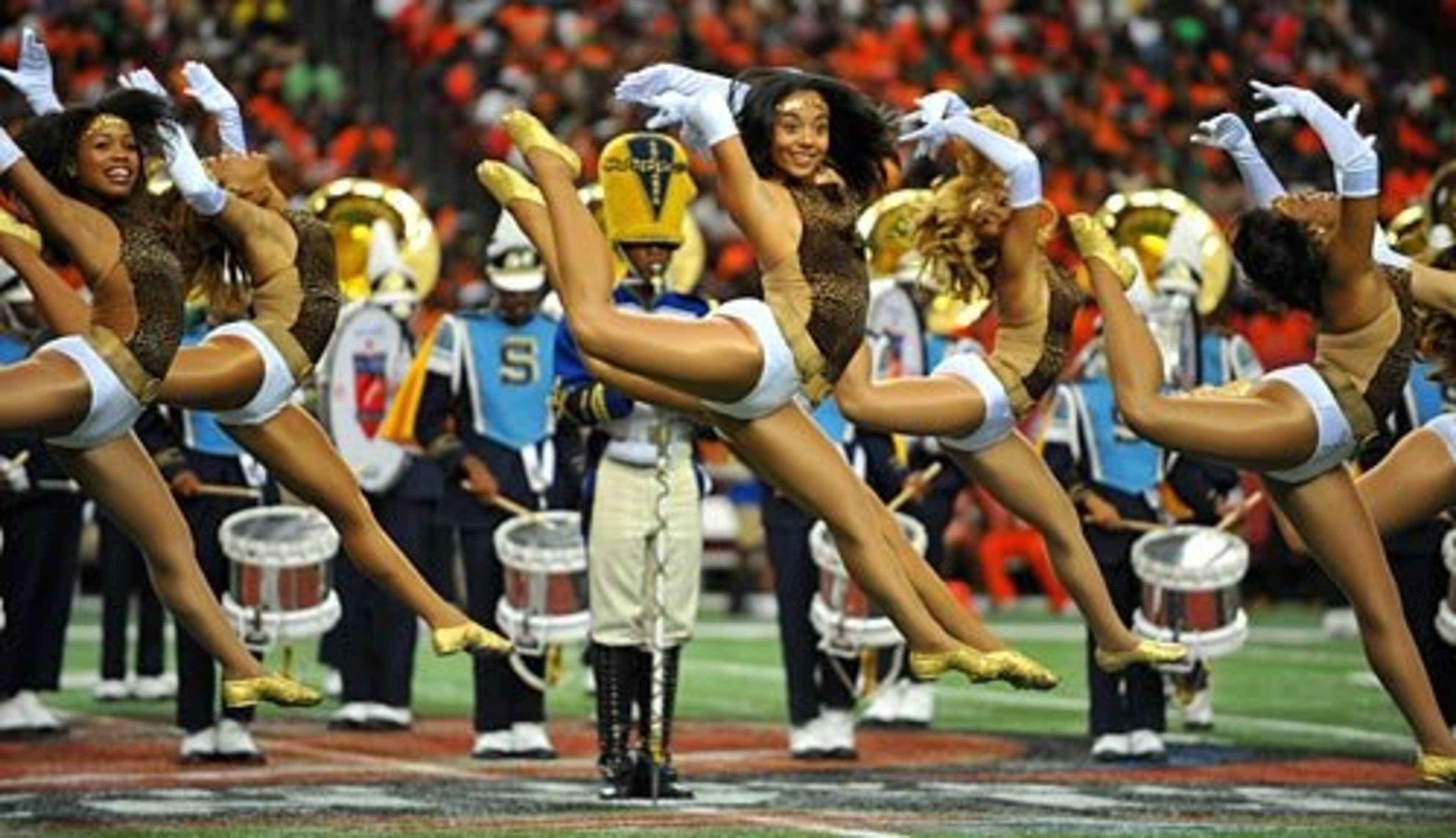 The Southern University Dancing Dolls perform with the marching band. Many fans attend the game just to see the bands perform.