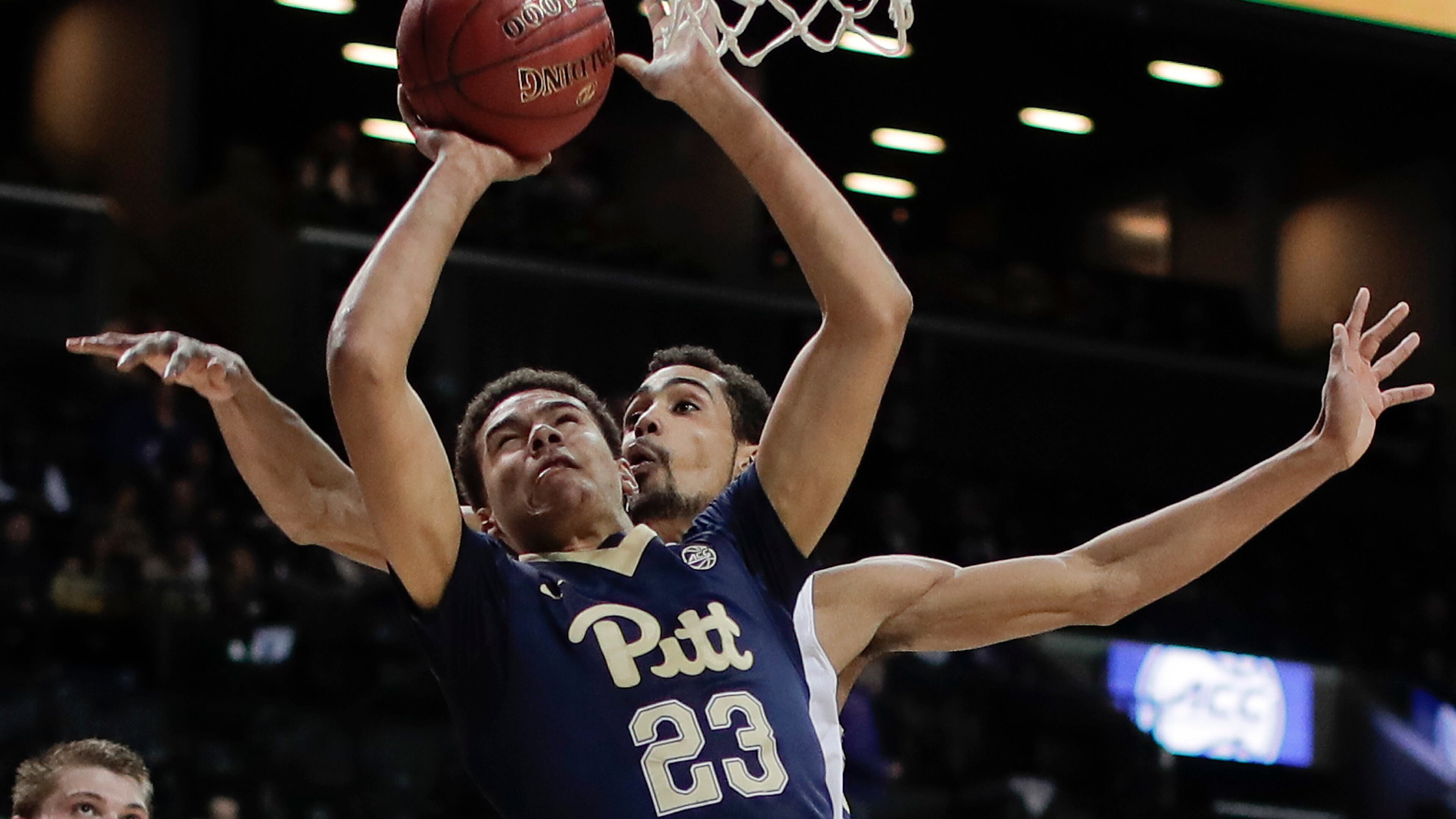 Pittsburgh guard Cameron Johnson (23) puts up a shot against Georgia Tech forward Quinton Stephens (12) during the first half of an NCAA college basketball game in the first round of the ACC tournament, Tuesday, March 7, 2017, in New York. (AP Photo/Julie Jacobson)