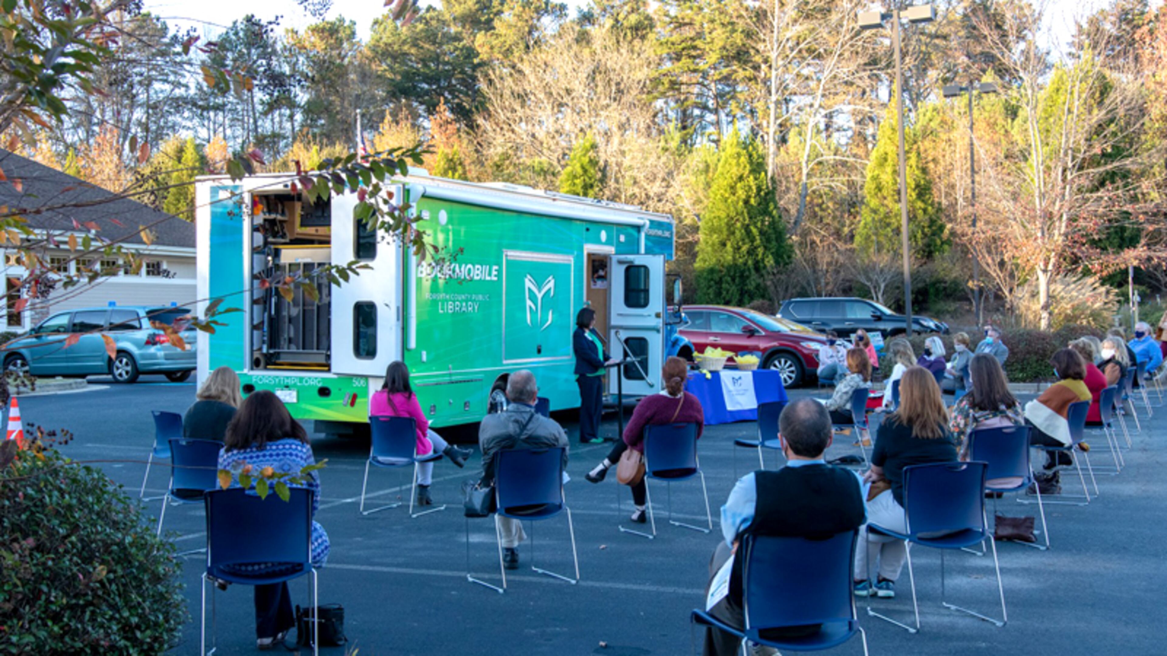 Forsyth County library and county government officials, staff and residents participate in a socially distanced ribbon cutting Nov. 16 to welcome "Loanie," the library's new $400,000 Bookmobile.