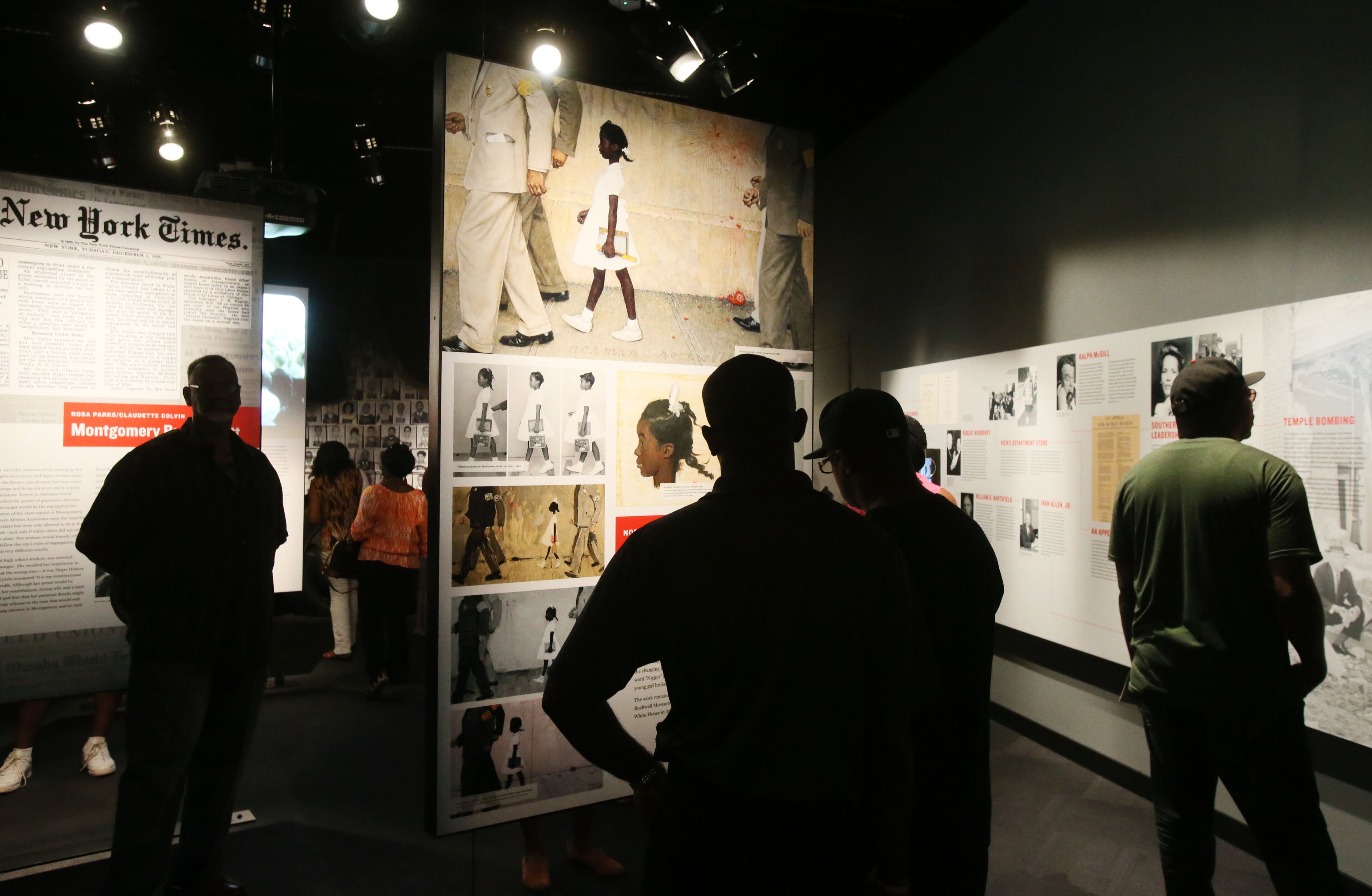 Visitors stroll through the National Center for Civil and Human Rights, which held its grand opening celebration Monday. The ceremony included speeches and a choir, which concluded the ceremony with a performance of "We Shall Overcome". BOB ANDRES / BANDRES@AJC.COM
