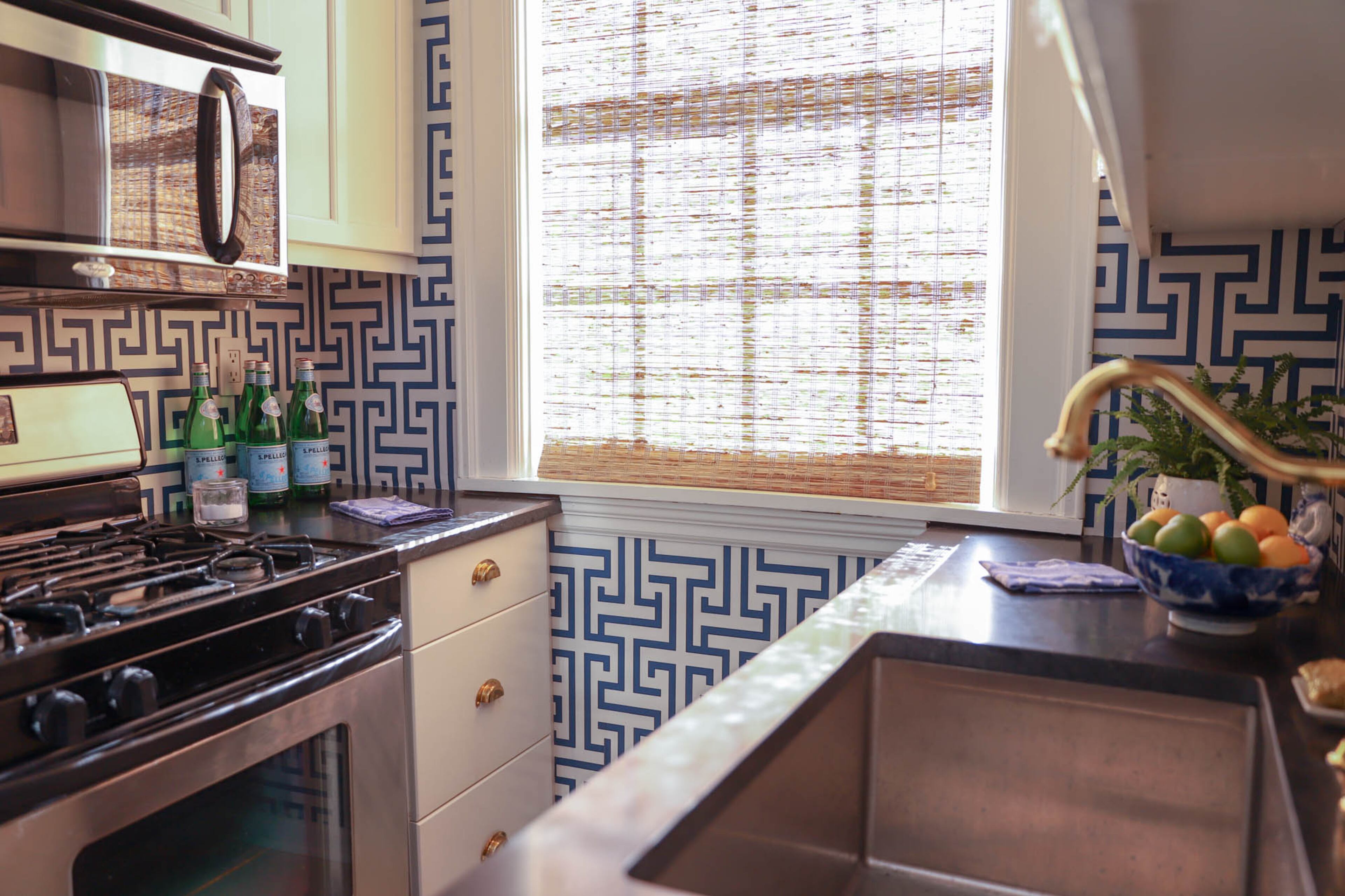 The updated kitchen has Whirlpool appliances, soapstone countertops and a Kingston Brass faucet.