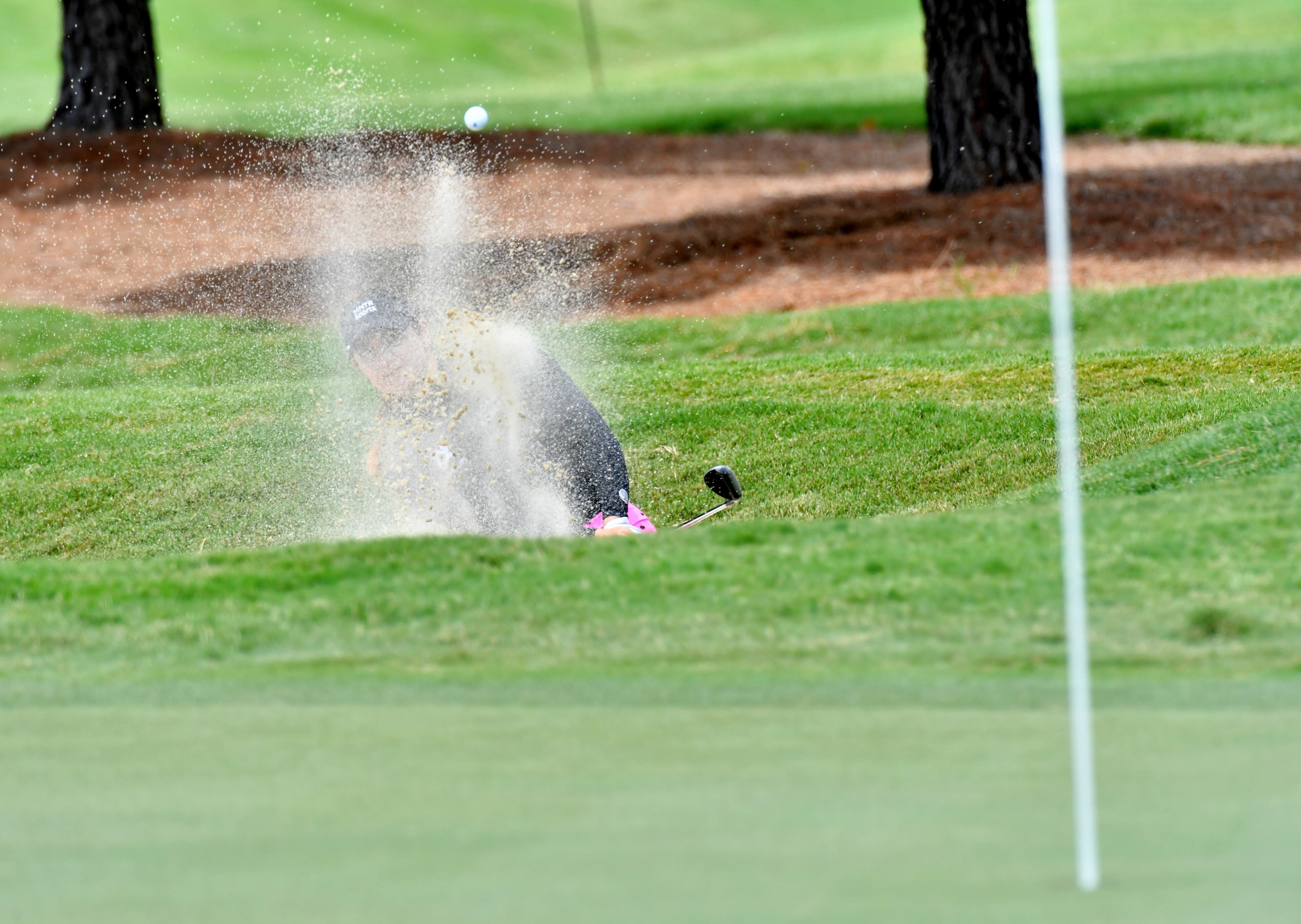 Ana Belac plays a shot from a bunker. (Hyosub Shin / Hyosub.Shin@ajc.com)