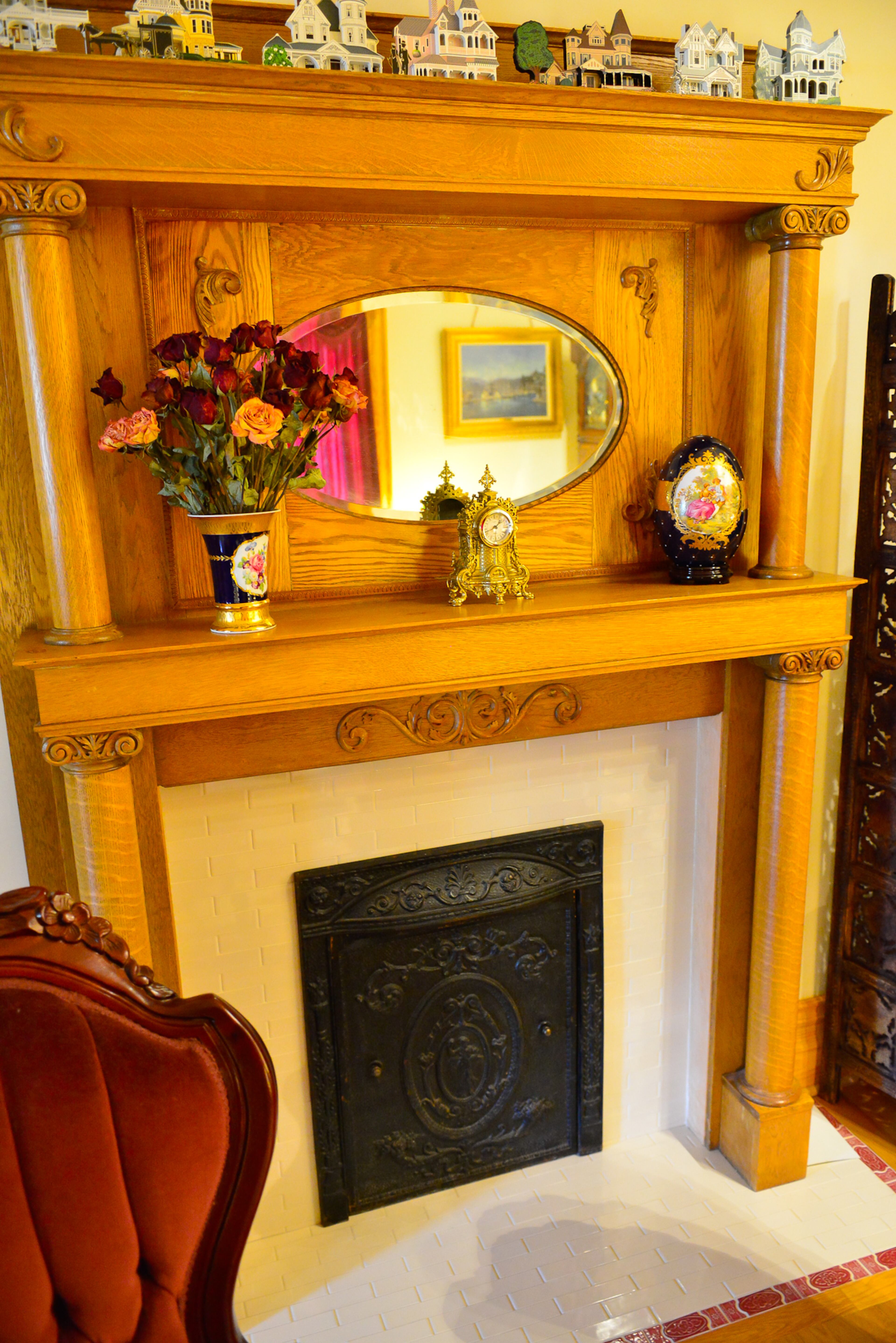 A mantle found at an antique store in Marietta before the home was finished makes the fireplace the focal point of the library. The gas fireplace has tile surround from Home Depot Expo.