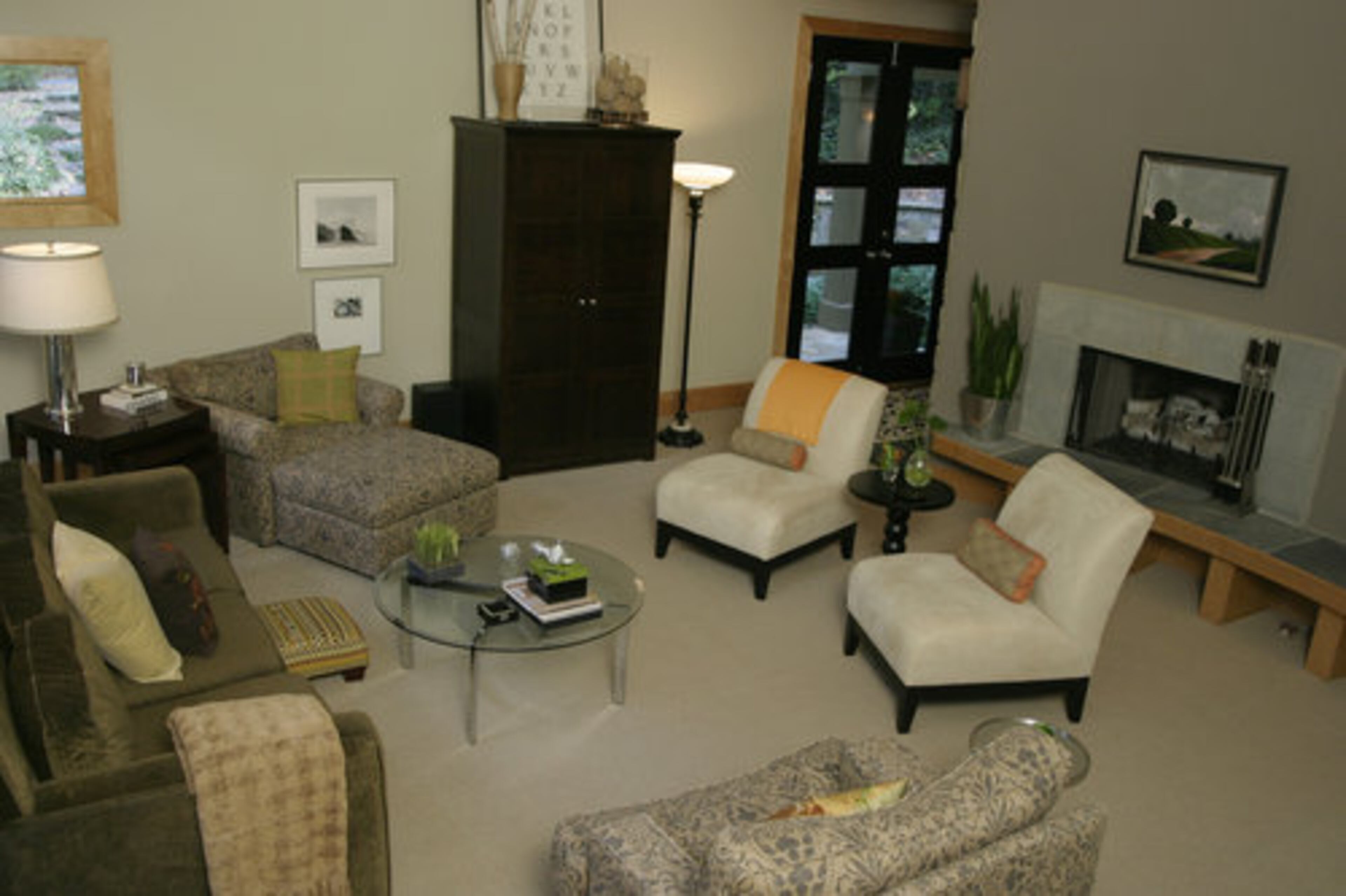 Kim, an interior designer, and Scott, a public relations executive, say their home was inspired by Frank Lloyd Wright. It includes earthy touches, such as the curved concrete fireplace in the living room.