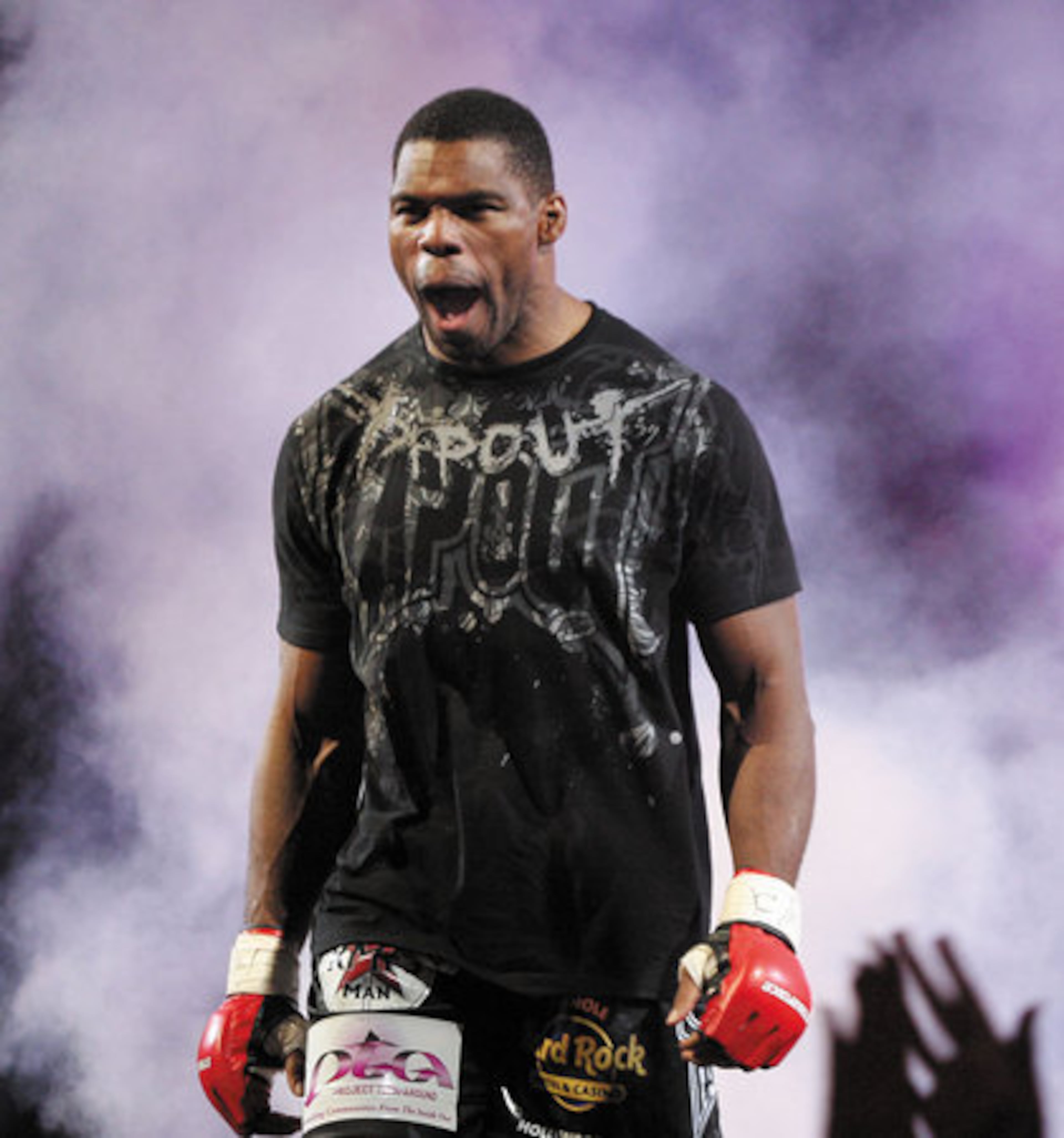 Herschel Walker, who made his mixed-martial arts debut on Saturday night, enters the ring.