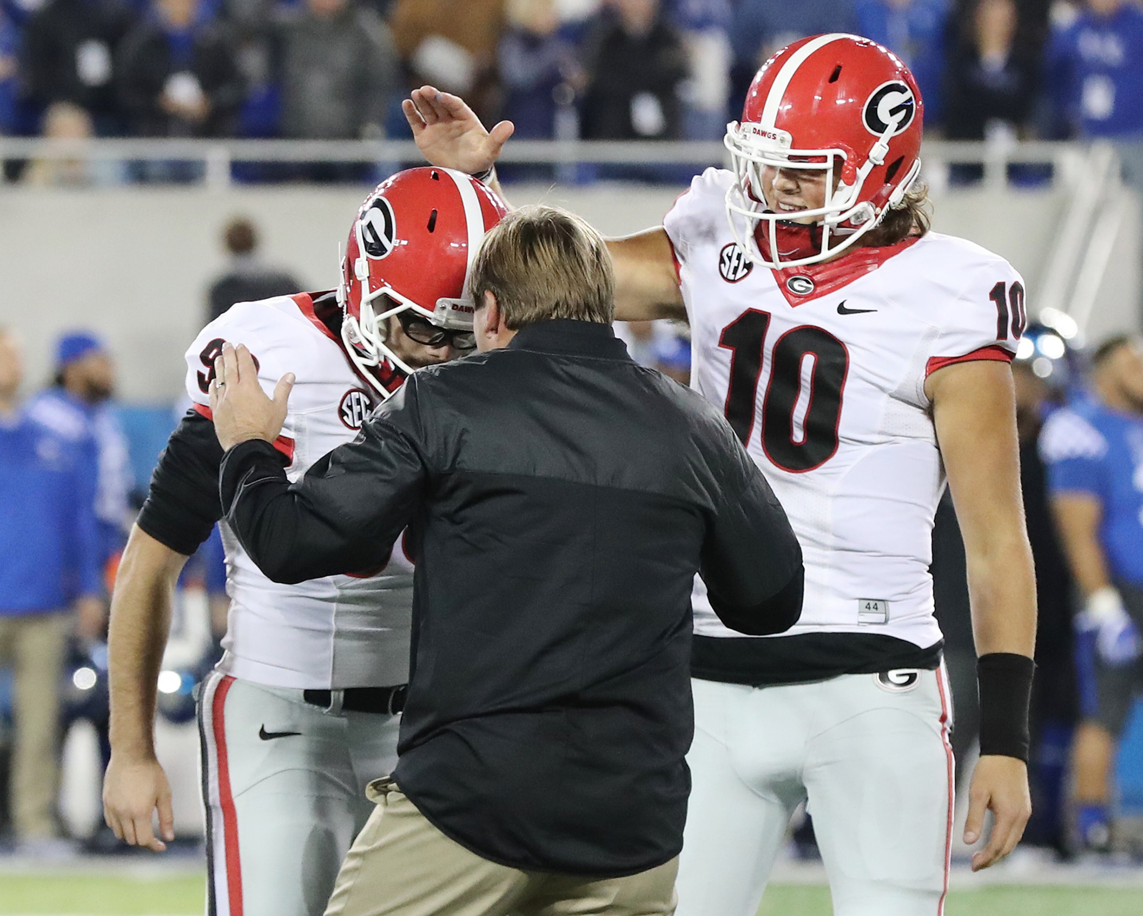 November 5, 2016, LEXINGTON: Georgia head coach Kirby Smart and quarterback Jacob Eason congratulate redshirt freshman Rodrigo Blankenship as he makes a game winning field goal to beat Kentucky 27-24 as time expires an NCAA college football game on Saturday, Nov. 5, 2016, in Lexington. Curtis Compton /ccompton@ajc.com