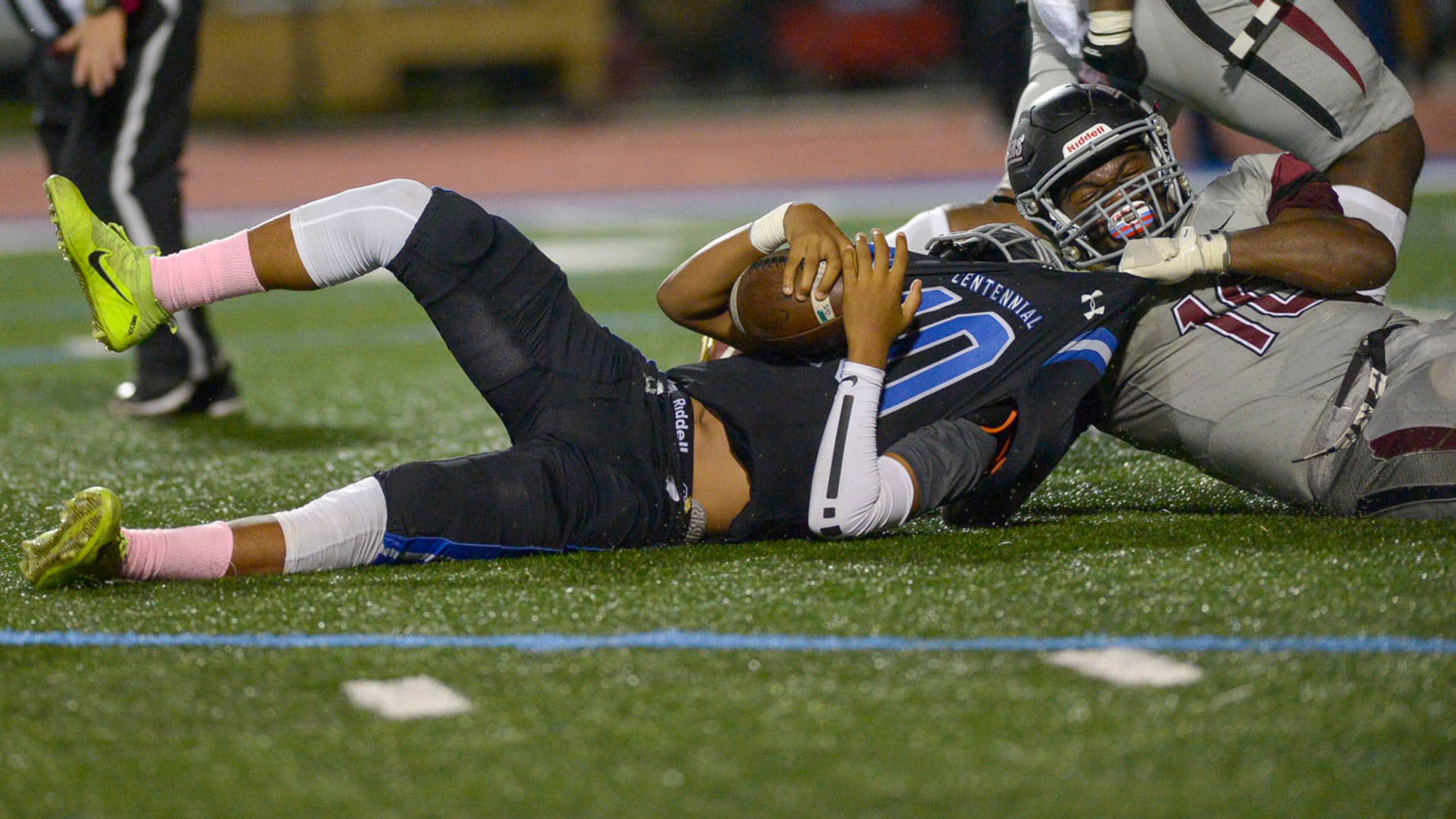 Alpharetta middle linebacker Jordan Leslie (10) sacks Centennial quarterback Zaire Goff in the second half of a game at Centennial two weeks ago. Centennial, the Region 7-AAAAAA runner-up in 2018, is 0-6 this year. (Daniel Varnado/Special)