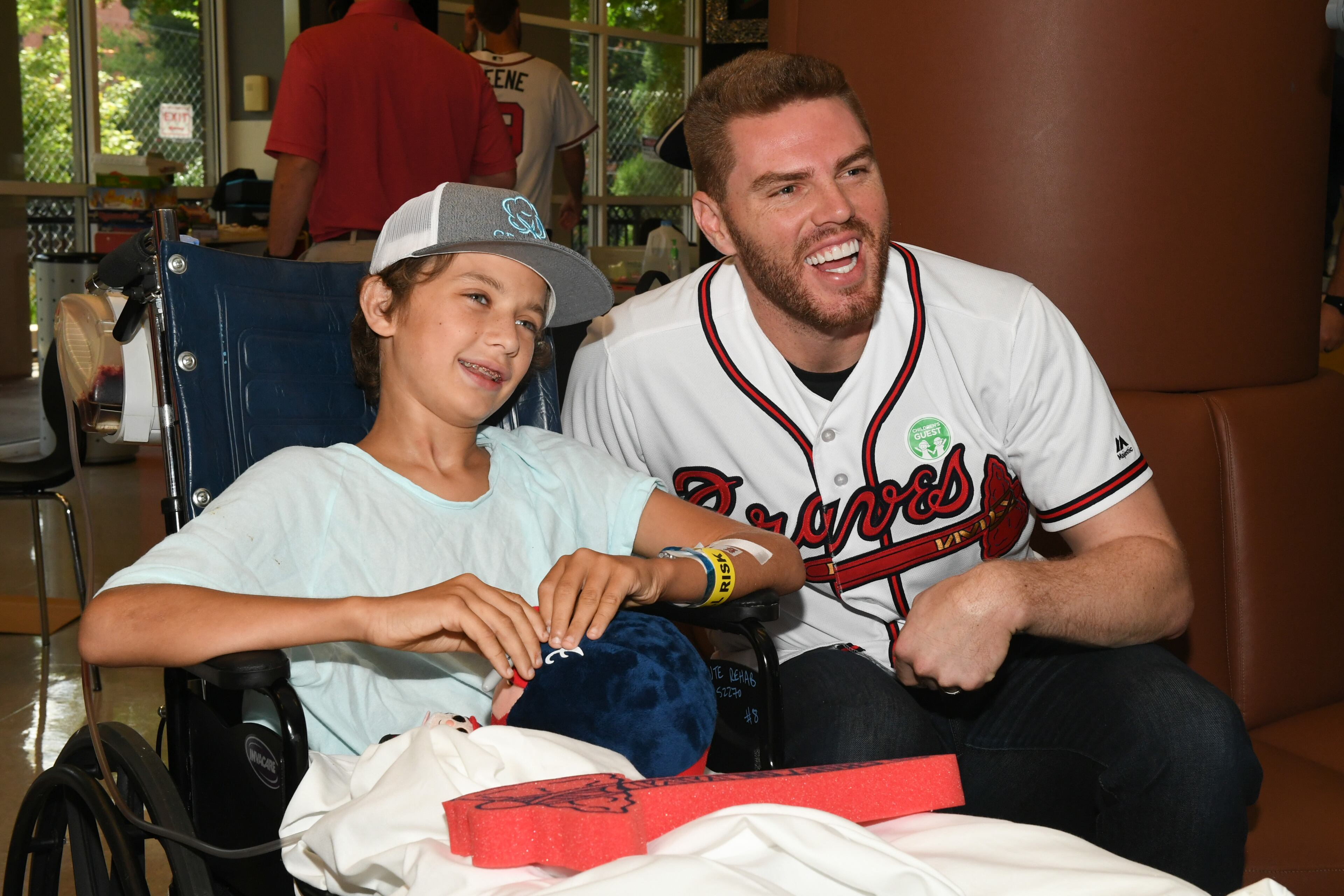 Braves first baseman Freddie Freeman spends some time with a young fan. Photo courtesy of the Atlanta Braves