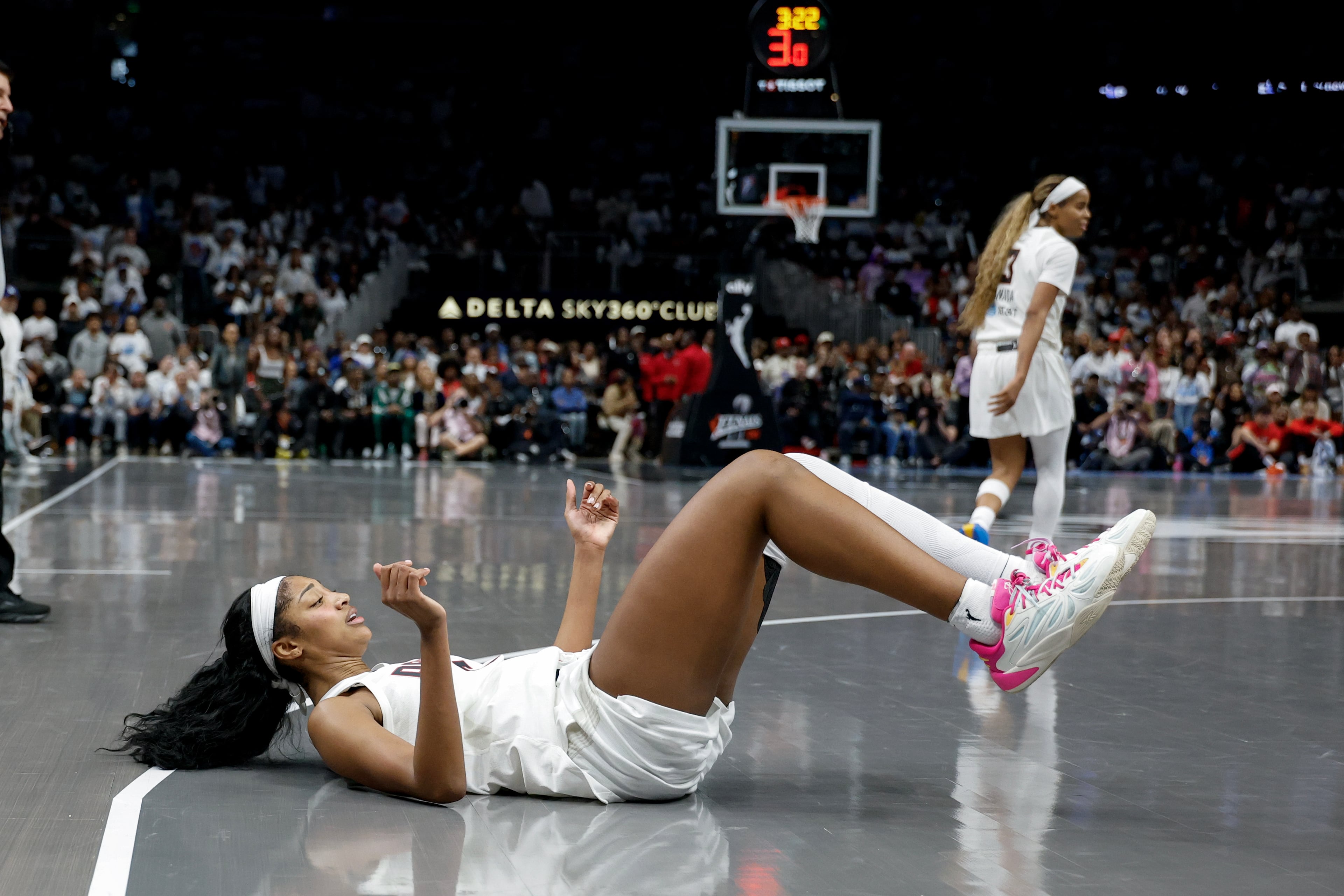 Atlanta Dream forward Angel Reese falls to the court after missing a shot against the Golden State Valkyries during the second half of Game 4 of the WNBA Finals between the Atlanta Dream and the Golden State Valkyries, Saturday, Oct. 24, 2026, in Atlanta. (Erik S. Lesser for the AJC)