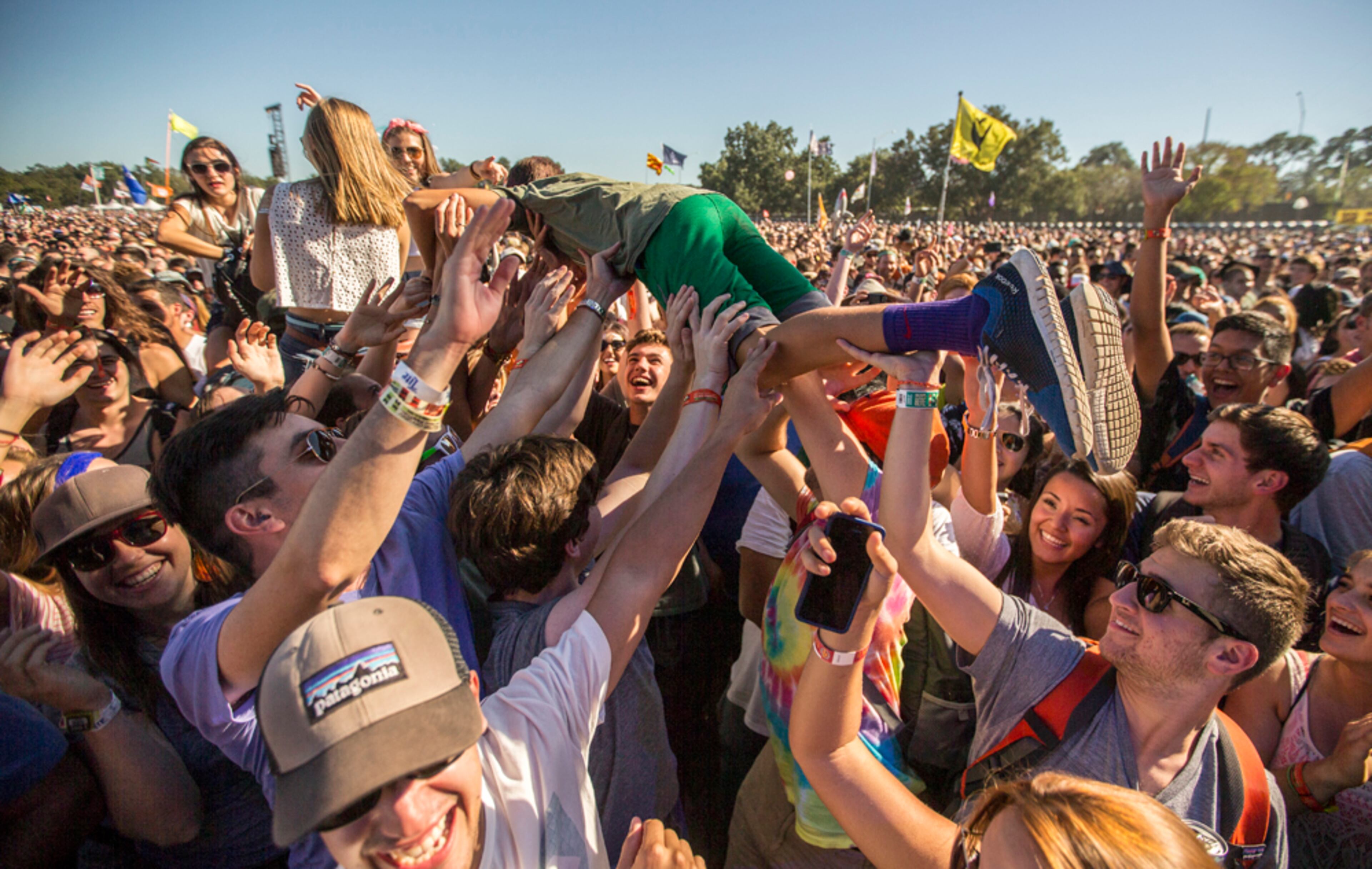 An ACL fan crowd surfs as Chidish Gambino performs at the Honda stage on Friday, Oct. 3, 2014.