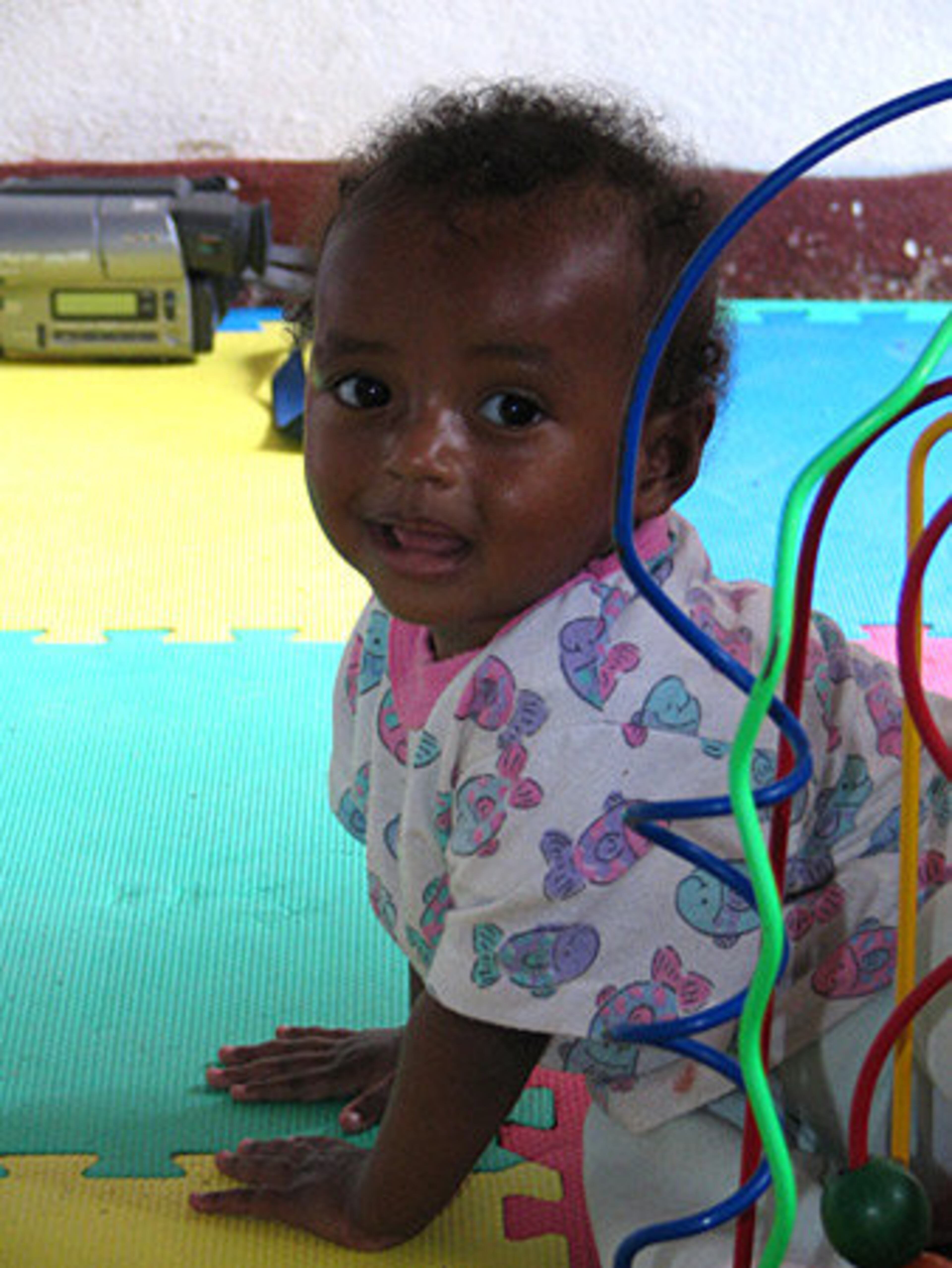 Miriam had short, patchy hair when Green snapped this photo of her in an Ethiopian orphanage in March 2005.