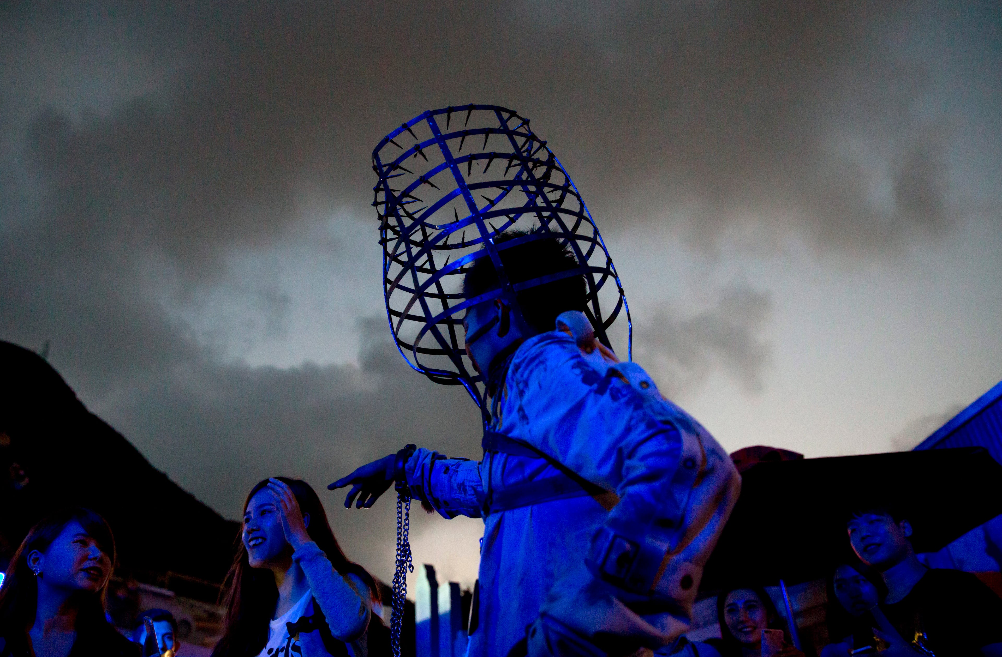 A performer dressed as an zombie scares tourists at Ocean Park to celebrate the Halloween festival in Hong Kong, Saturday, Oct. 31, 2015. (AP Photo/Kin Cheung)