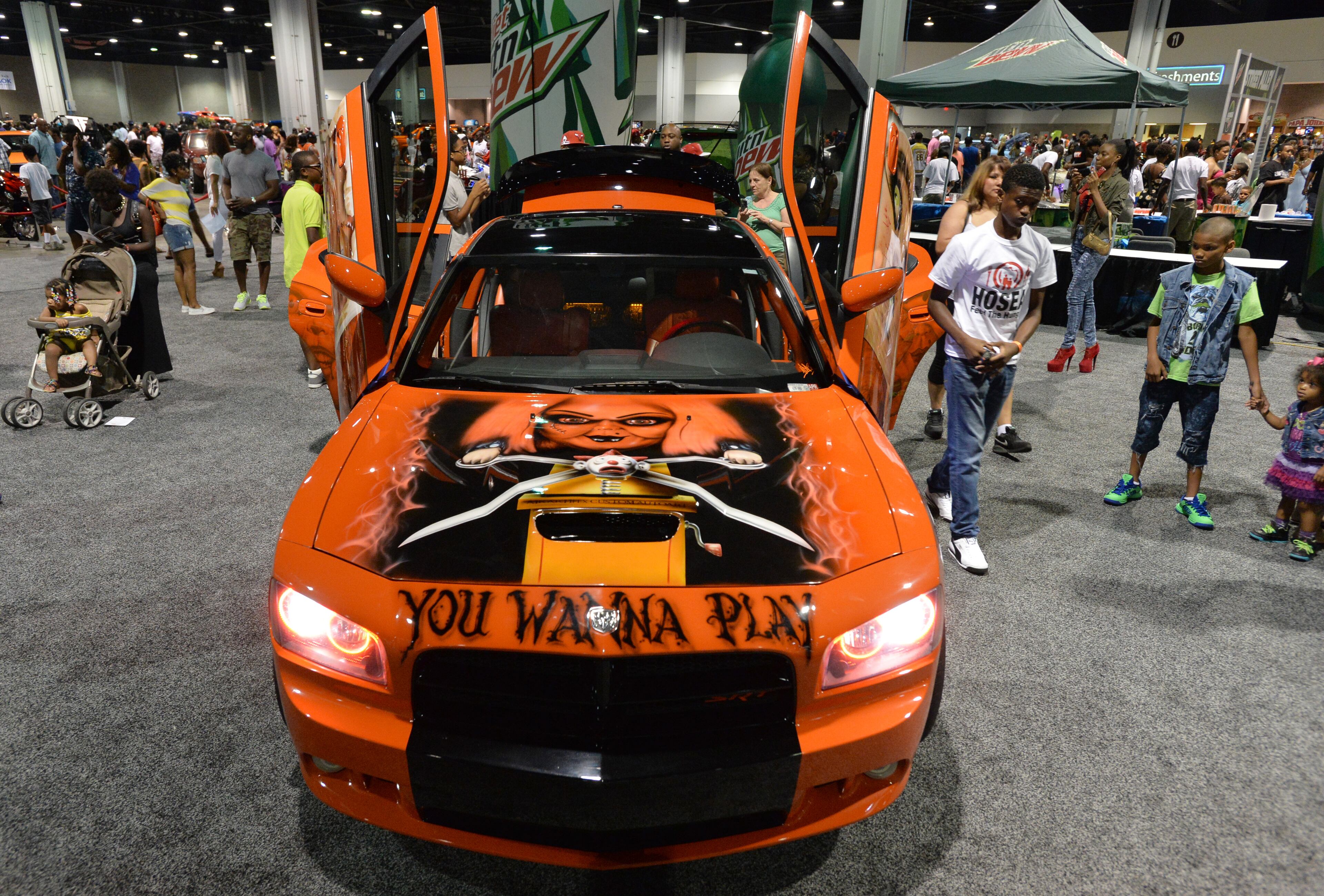 Custom vehicles lined-up for event-goers during The 2014 V-103/WAOK Car & Bike Show at the Georgia World Congress Center on Saturday, July 12, 2014.