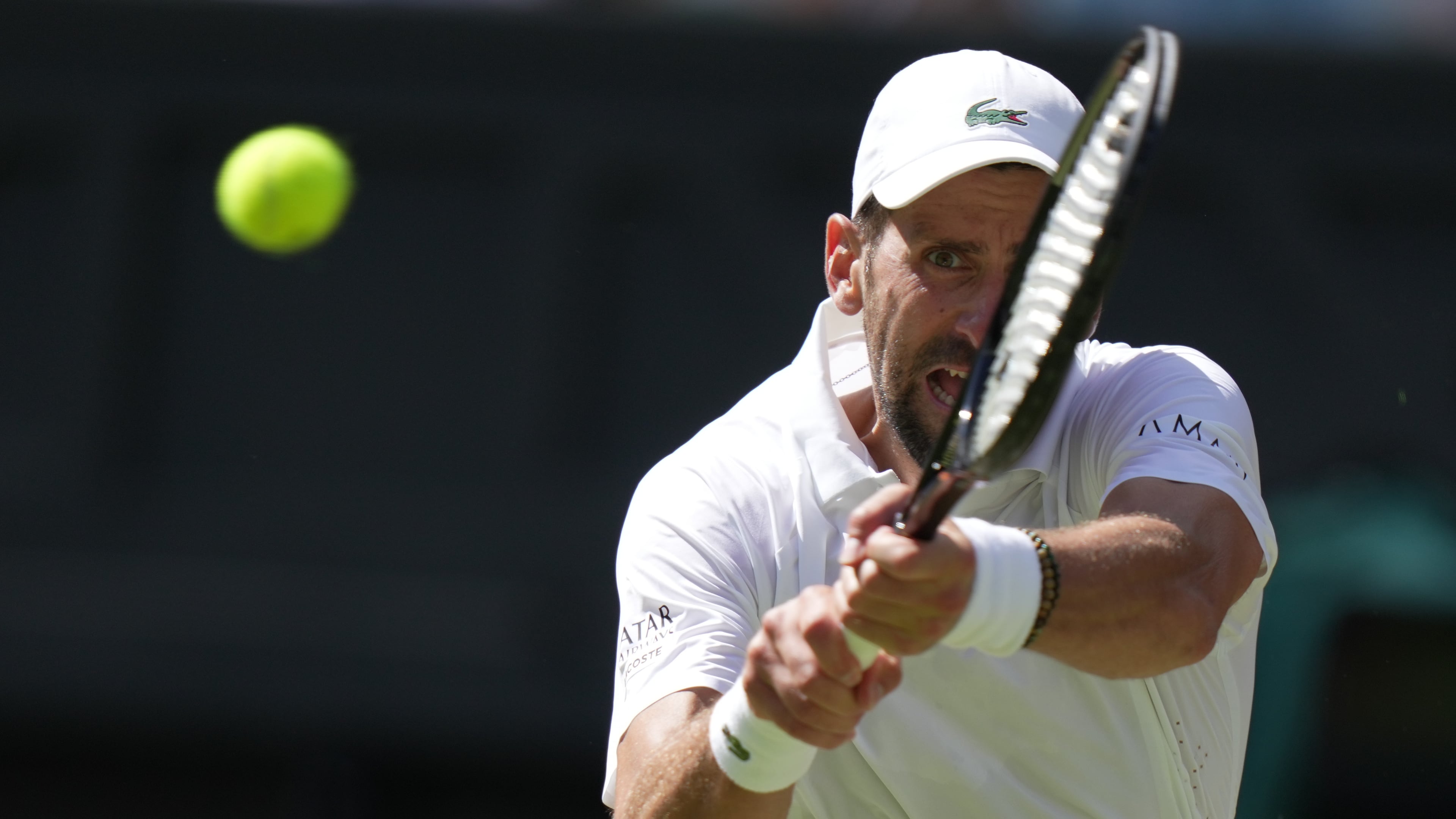 FILE - Novak Djokovic, of Serbia, returns the ball to Roman Saffiullin, of Russia, in their fourth round men's singles match at the Wimbledon Tennis Championships in London, July 5, 2026. (AP Photo/Brian Inganga, File)