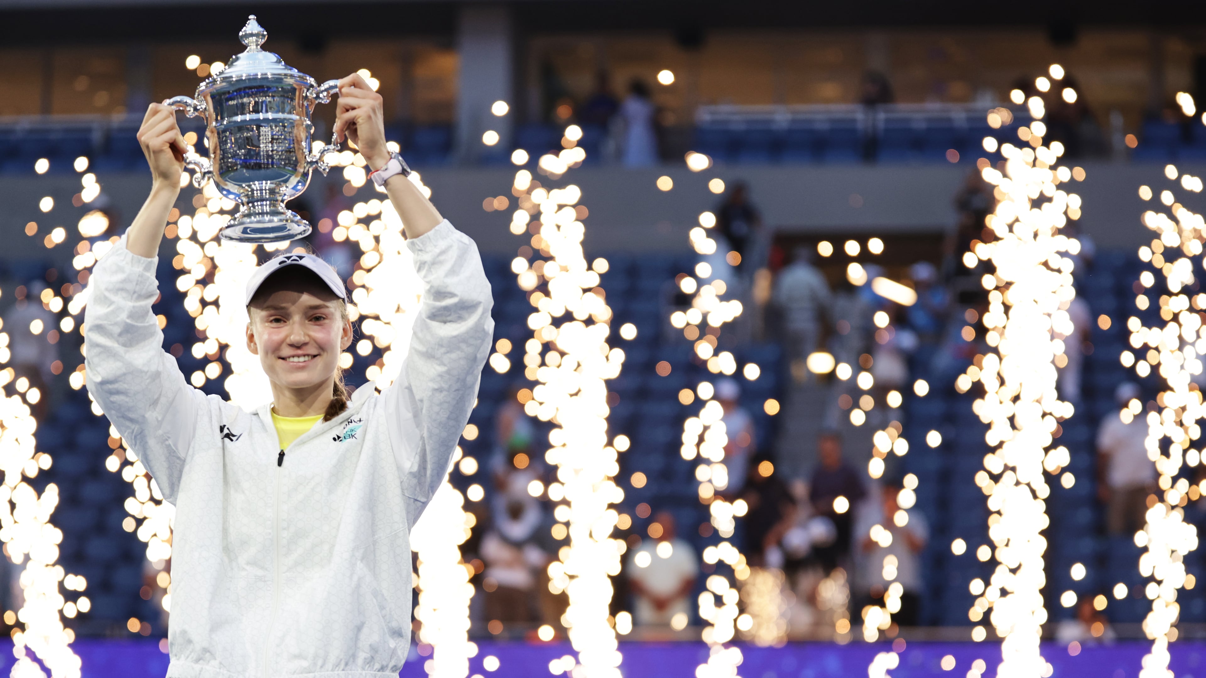 Elena Rybakina, of Kazakhstan, holds up her trophy after winning the women's singles final of the U.S. Open tennis championships against Aryna Sabalenka, of Belarus, Saturday, Sept. 12, 2026, in New York. (AP Photo/Adam Hunger)