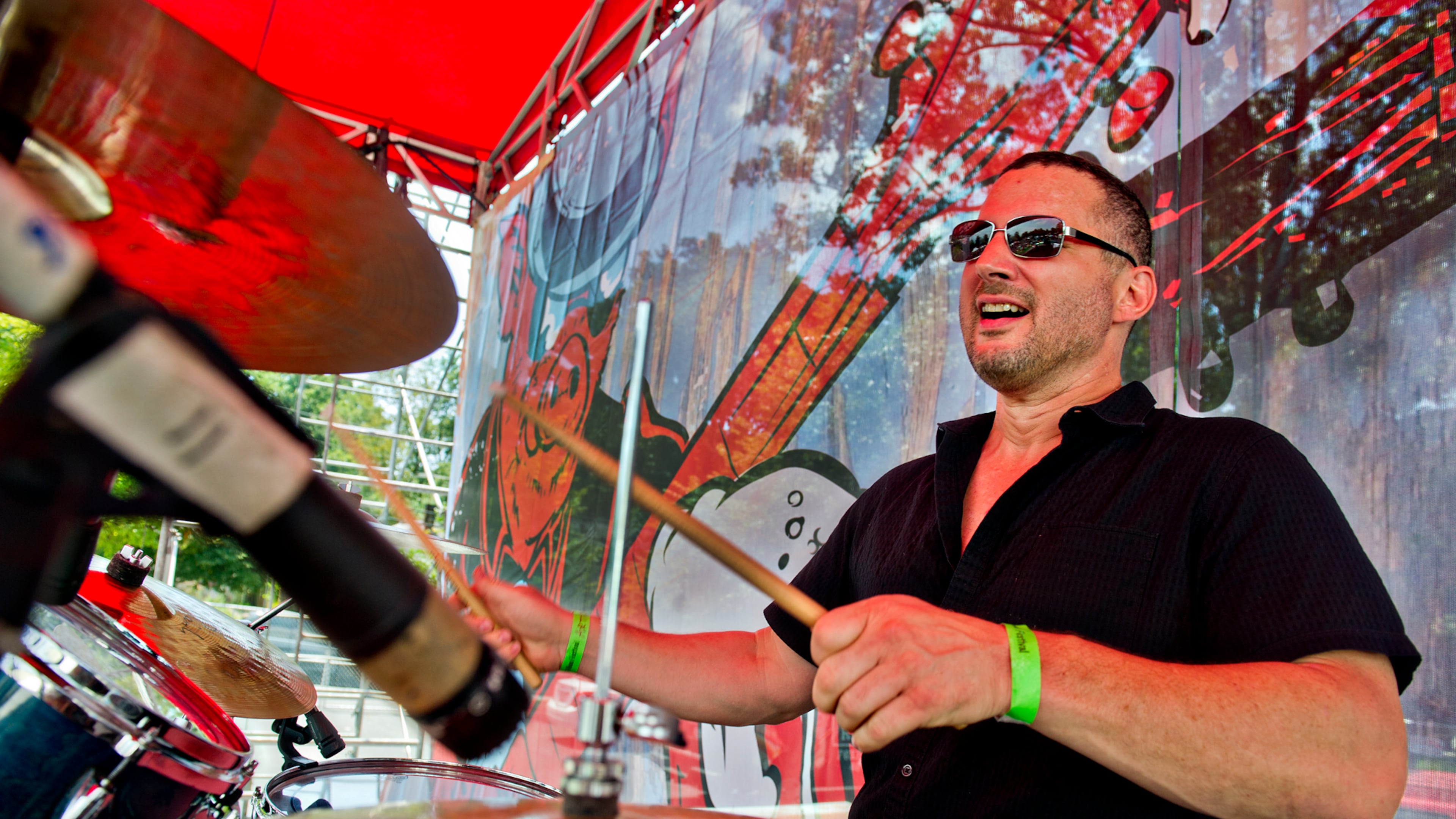 Rich Simmons from the band The Georgia Flood performs during the Decatur BBQ, Blues & Bluegrass Festival at Harmony Park in Decatur on Saturday, August 16, 2014. The 14th annual festival featured over seven hours of blues and bluegrass performances as well as beer, barbeque and children's activities.