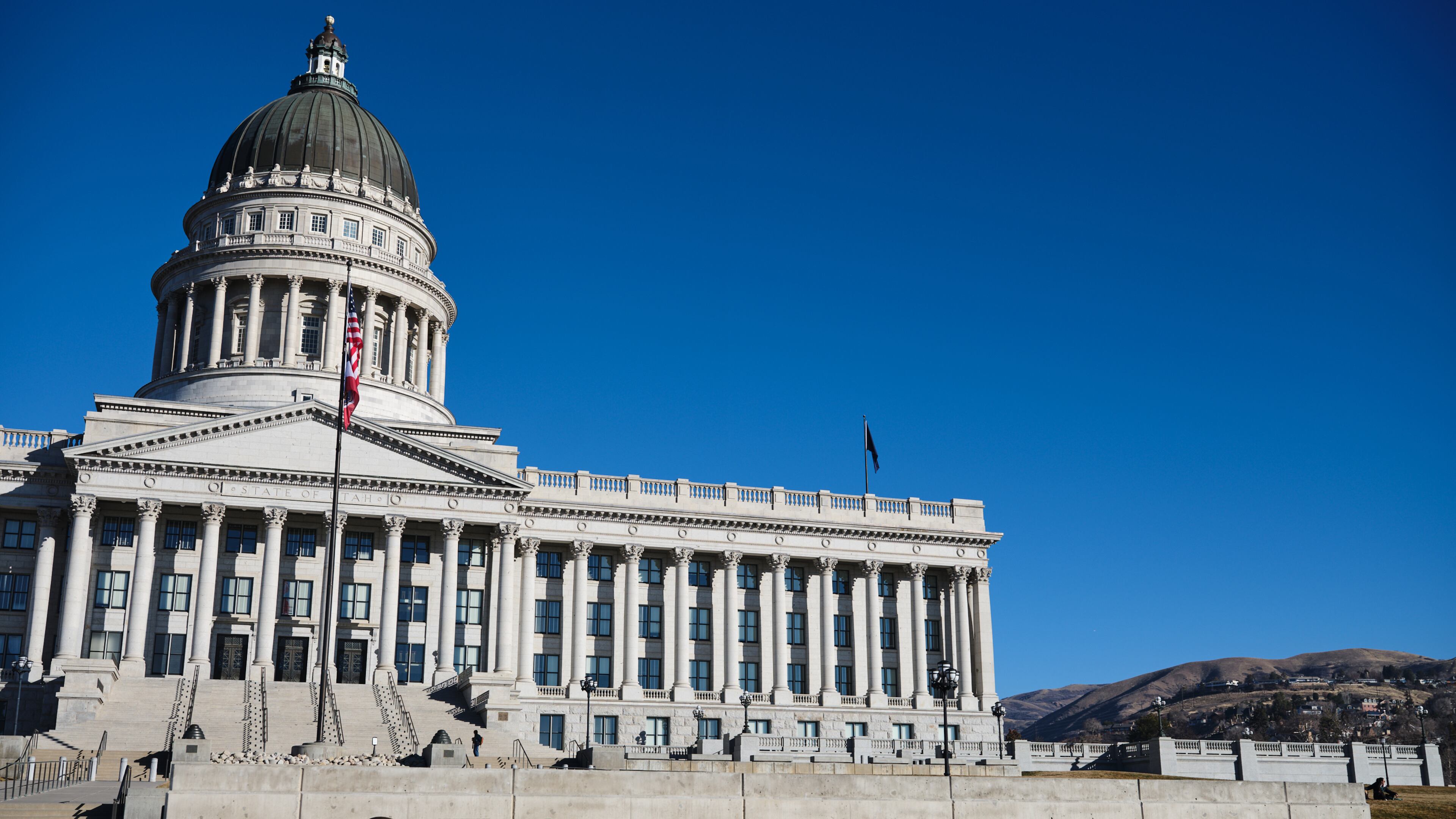 FILE - Flags fly at the Utah State Capitol, Jan. 18, 2026, in Salt Lake City. (AP Photo/Sydney Schaefer, File)