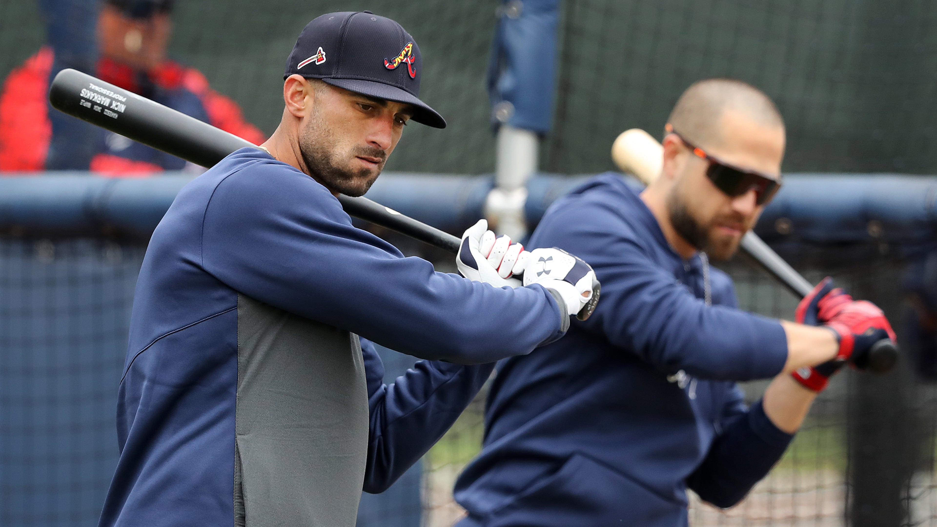 Chilly Friday in Florida: Nick Markakis and Ender Inciarte work on their swings during Friday's cold morning practice in North Port, Fla. The Braves will play their first exhibition game Saturday when the host the Orioles at CoolToday Park. (Curtis Compton/ccompton@ajc.com)