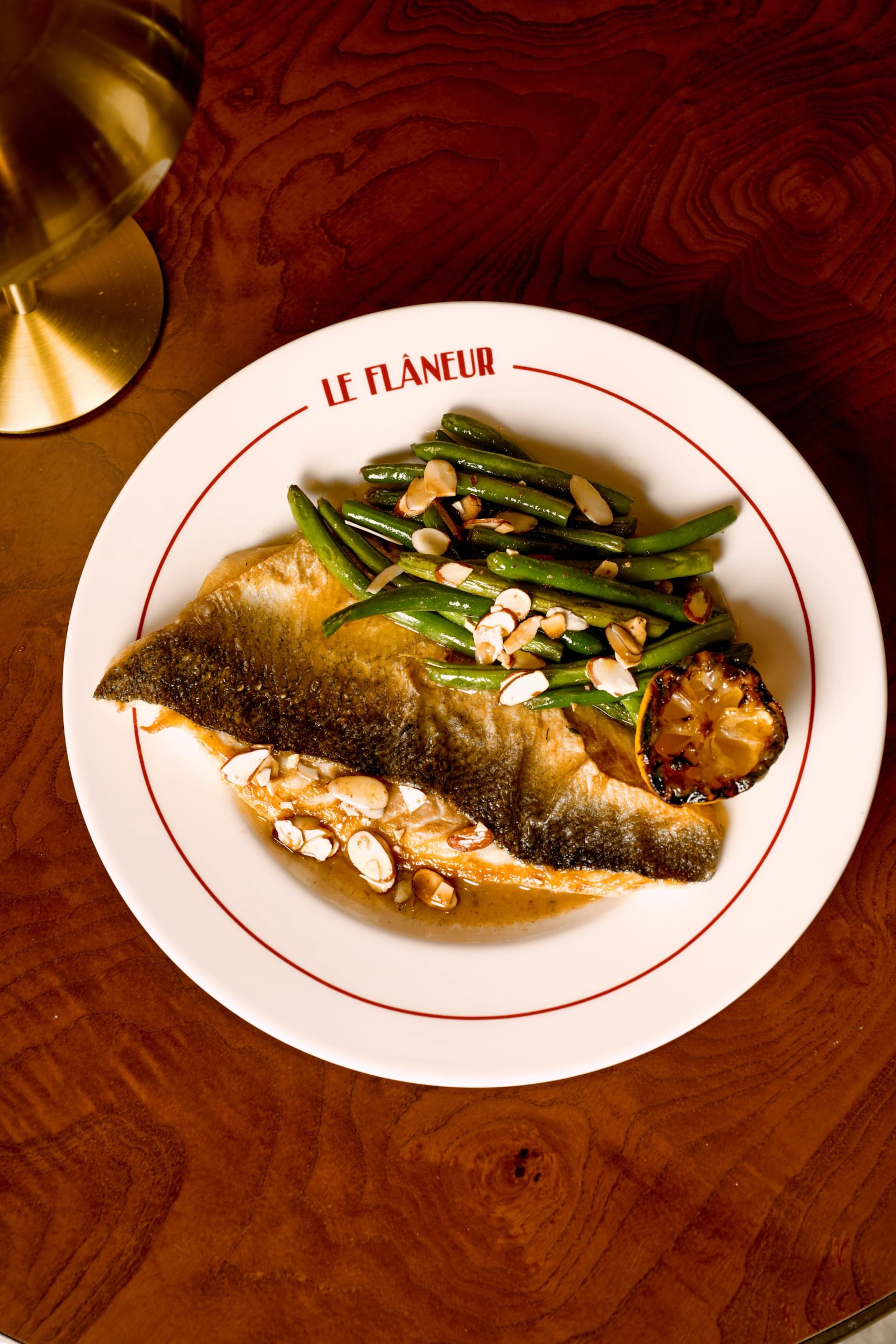 The dinner menu at Le Flâneur includes sea bass meunière . (Kathryn Ann Waller/Courtesy of Le Flaneur)