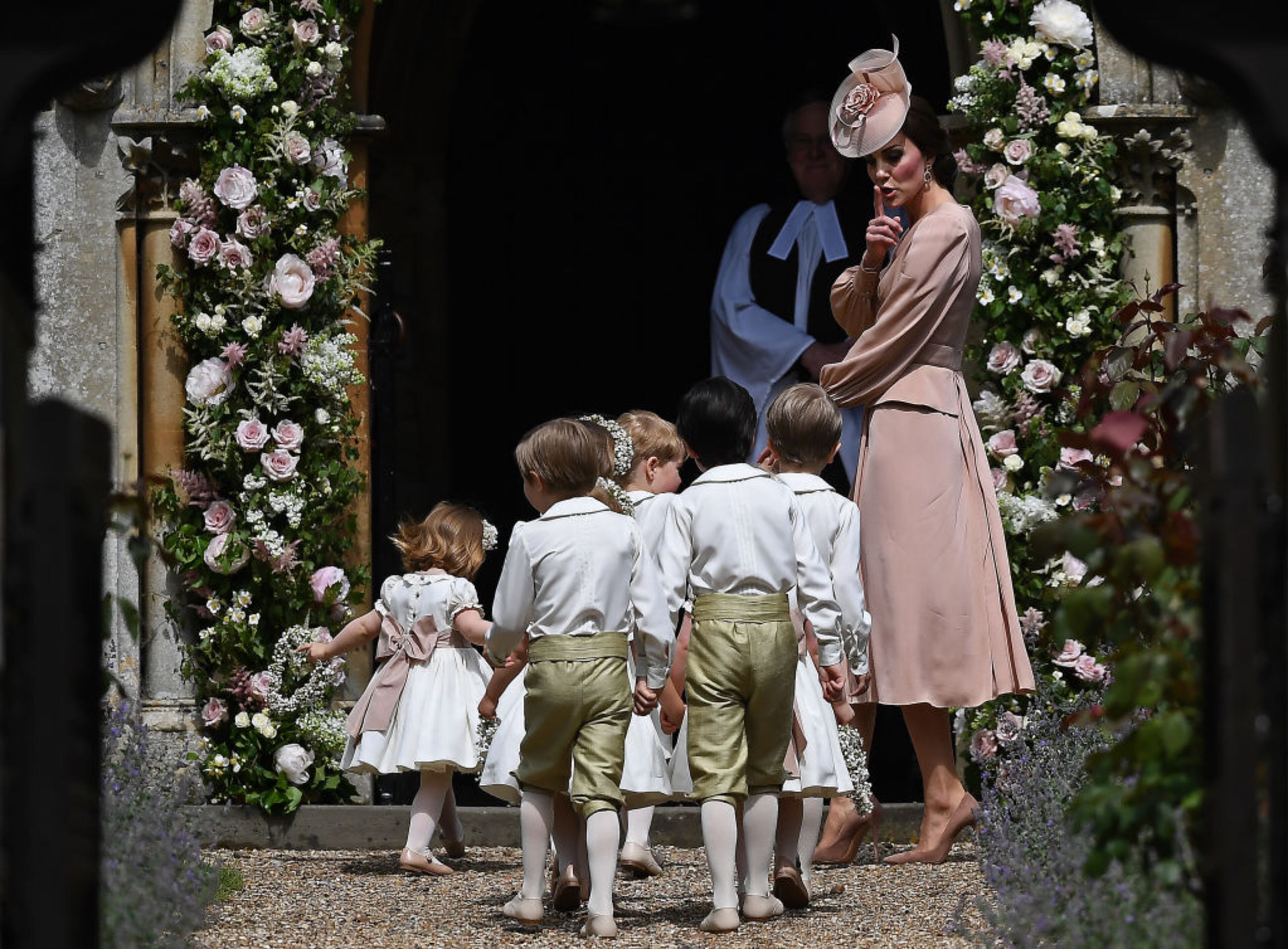 ENGLEFIELD GREEN, ENGLAND - MAY 20: Britain's Catherine, Duchess of Cambridge (R) walks with the bridesmaids and pageboys as they arrive as they arrive for her sister Pippa Middleton's wedding to James Matthews at St Mark's Church on May 20, 2017 in Englefield Green, England. (Photo by Justin Tallis - WPA Pool)
