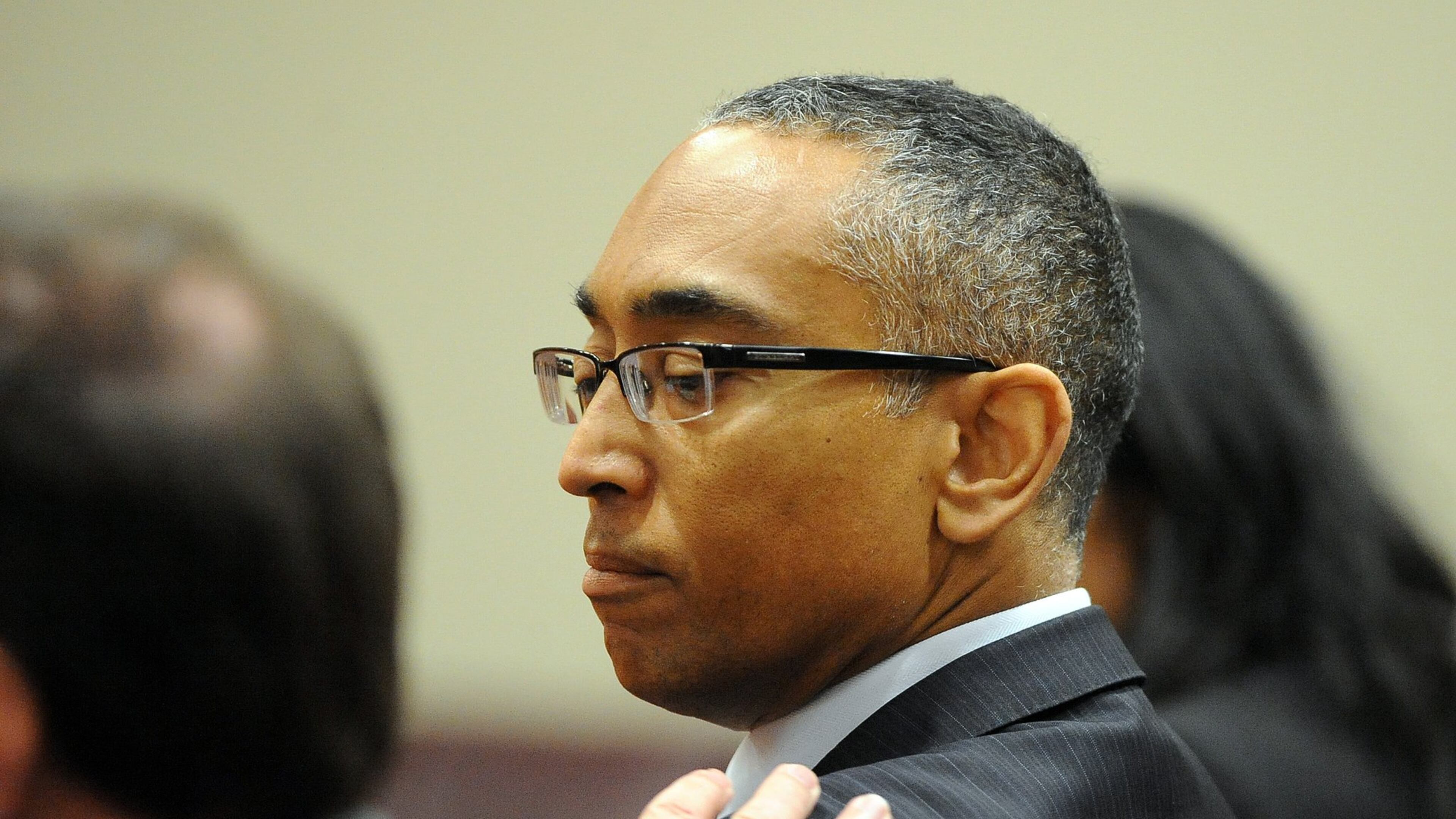 Ellis talks with his defense attorney Craig Gillen before the verdicts were read July 8, 2015. KENT D. JOHNSON /KDJOHNSON@AJC.COM