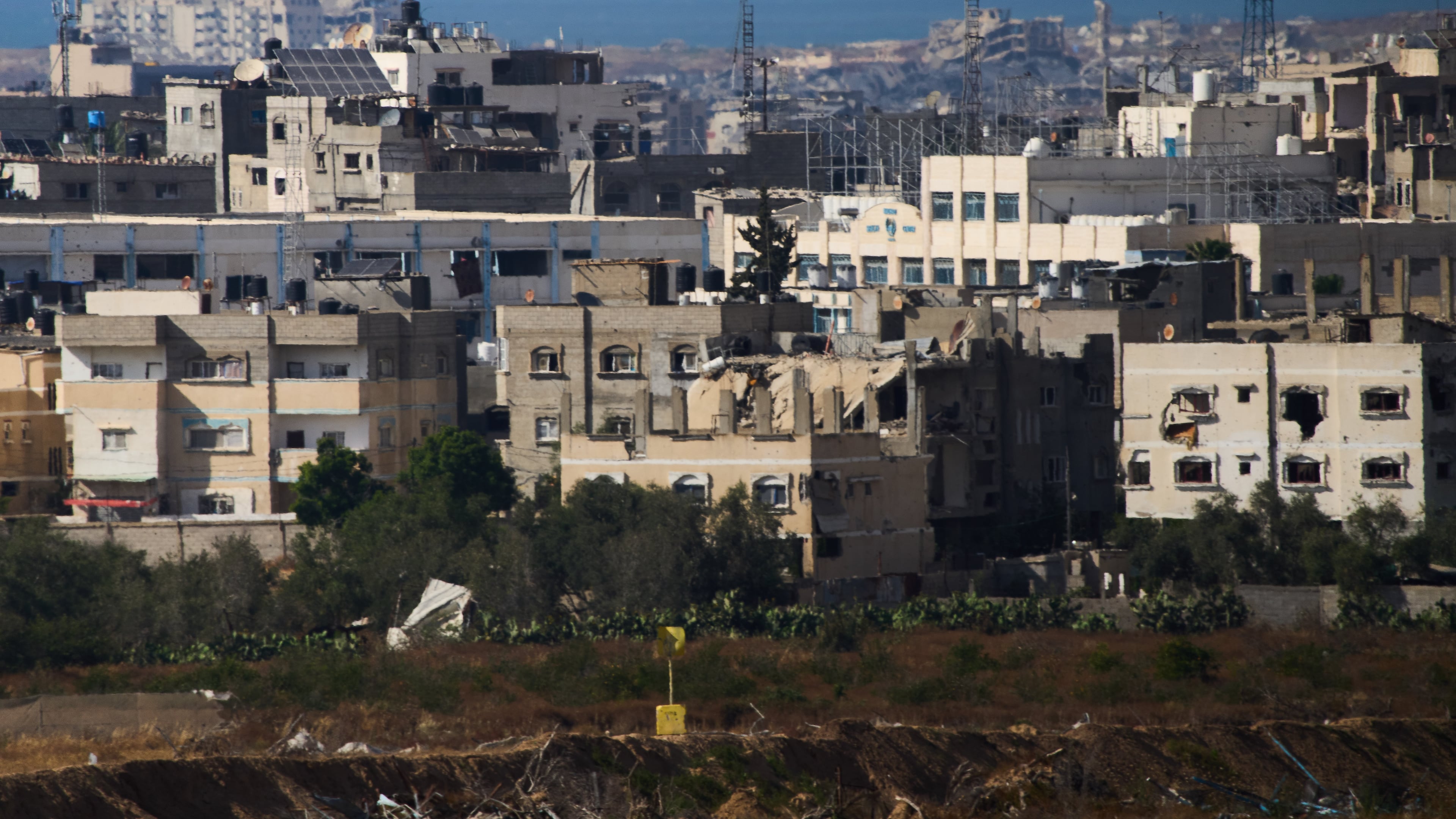A yellow block stands demarcating the "Yellow Line," which has separated the Gaza Strip's Israeli-held and Palestinian zones since the October ceasefire, is visible in central Gaza Strip, Tuesday, May 26, 2026. (AP Photo/Ariel Schalit)
