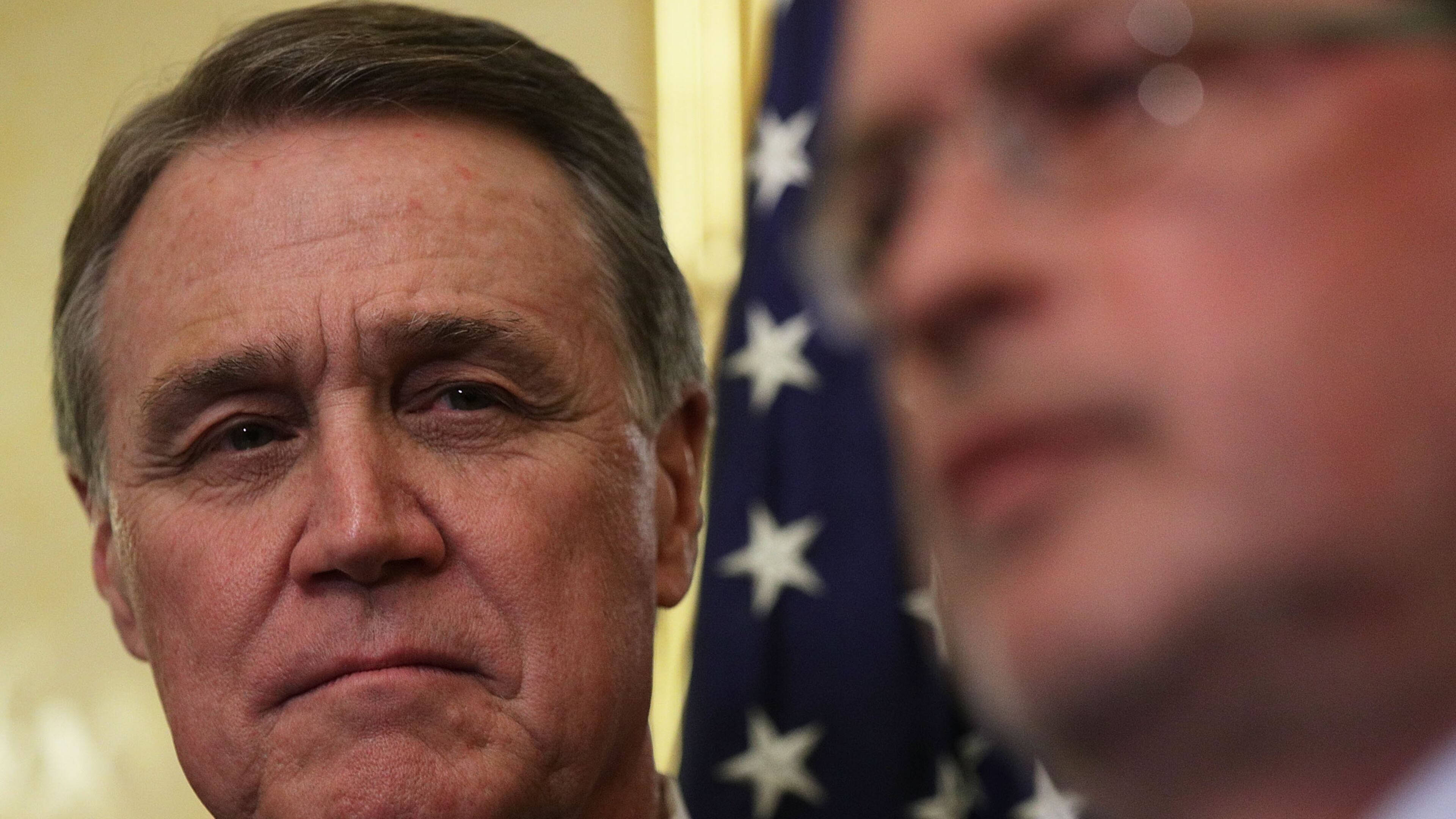 U.S. Sen. David Perdue, R-Ga., (left) in a 2017 file photo. Alex Wong/Getty Images