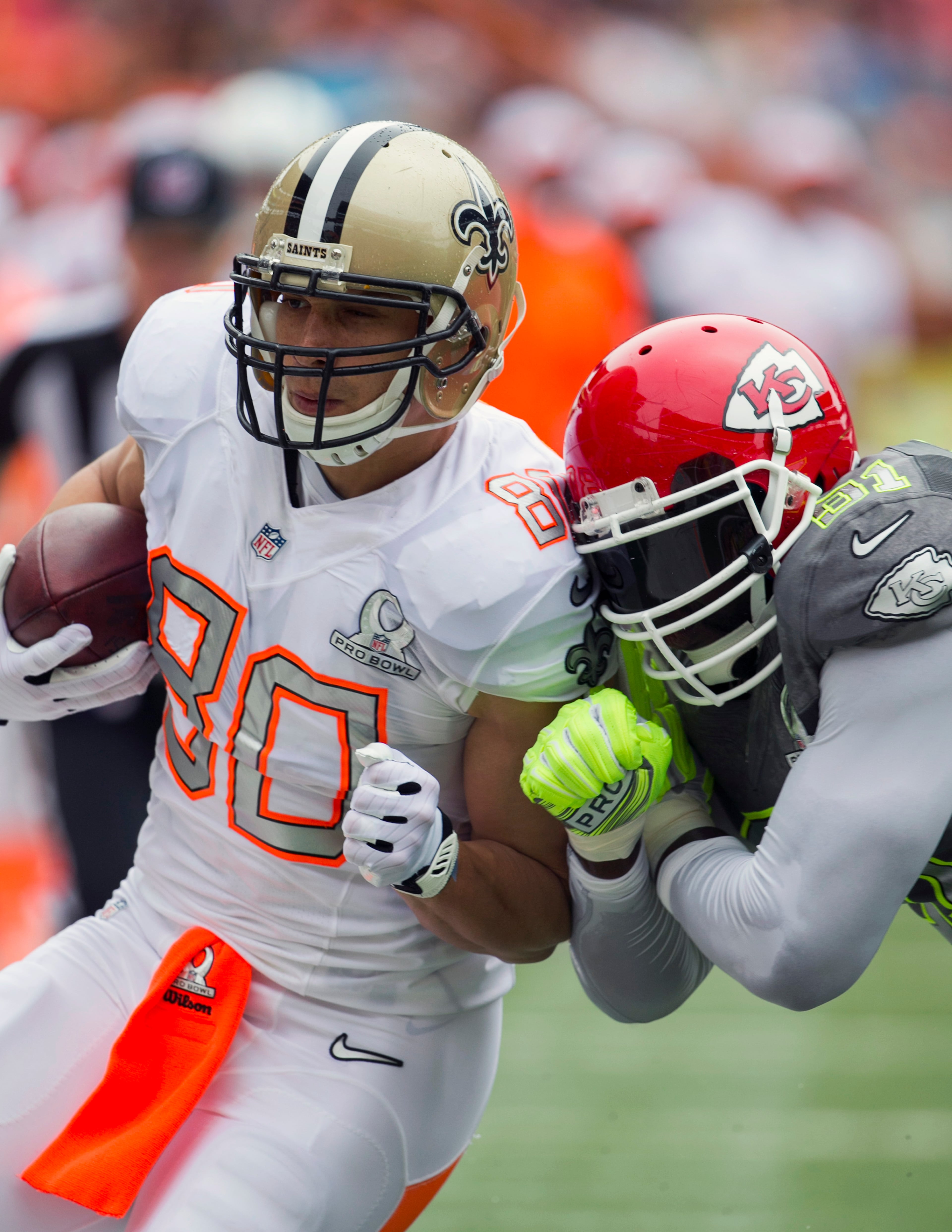 New Orleans Saints tight end Jimmy Graham (80), of Team Rice, gets pushed out of bounds by Kansas City Chiefs linebacker Tamba Hali (91), of Team Sanders, during the first quarter at the NFL Pro Bowl football game at Aloha Stadium, Sunday, Jan. 26, 2014, in Honolulu. (AP Photo/Marco Garcia)