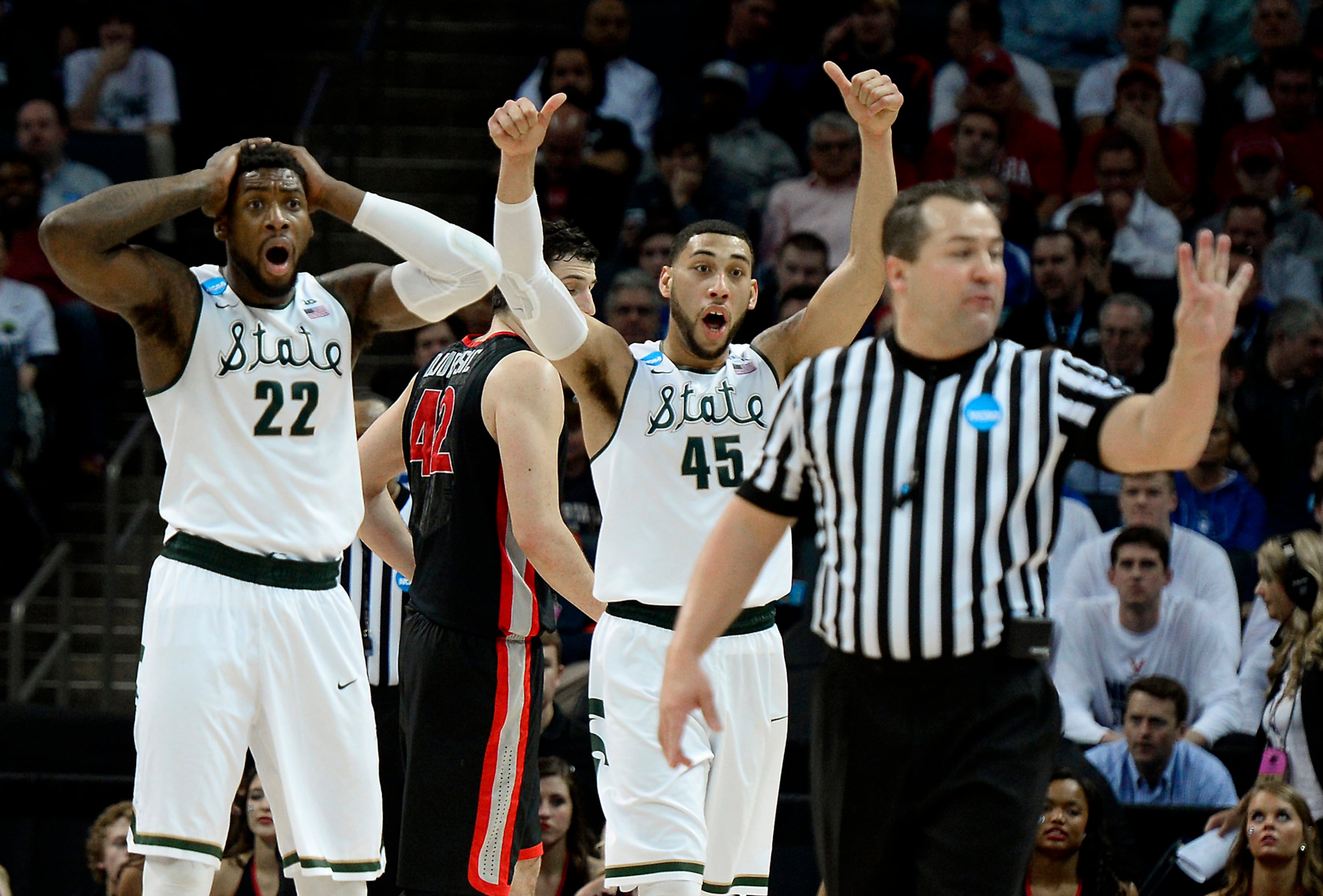 Michigan State's Branden Daswson (22) and Denzel Valentine (45) cannot understand an official's call during second half action vs the Georgia Bulldogs in the 2015 NCAA Division I Men's Second Round Basketball Championship action at Time Warner Cable Arena on Friday, March 20, 2015 in Charlotte, N.C. Michigan State defeated Georgia 70-63. (Jeff Siner/Charlotte Observer/TNS)