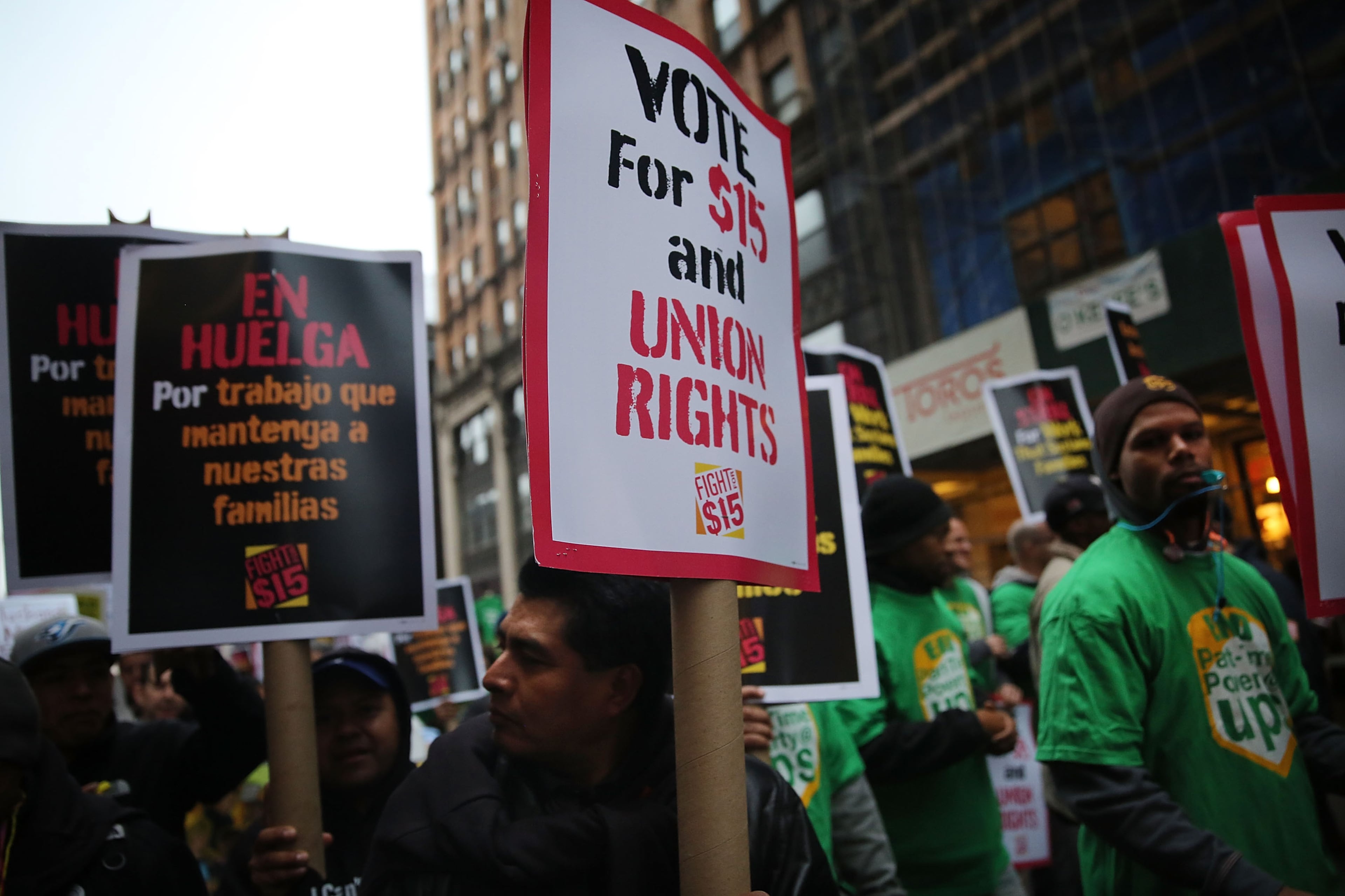 NEW YORK, NY - NOVEMBER 10: Low wage workers and supporters protest for a $15 an hour minimum wage on November 10, 2015 in New York, United States. In what organizers are calling a National Day of Action for $15 and hour minimum wage, thousands of people took to the streets across the country to stage protests in front of businesses that are paying some of their workers the minimum wage. Home care workers, employees in retail and fast food restaurants say that the current minimum is not a living wage. (Photo by Spencer Platt/Getty Images)