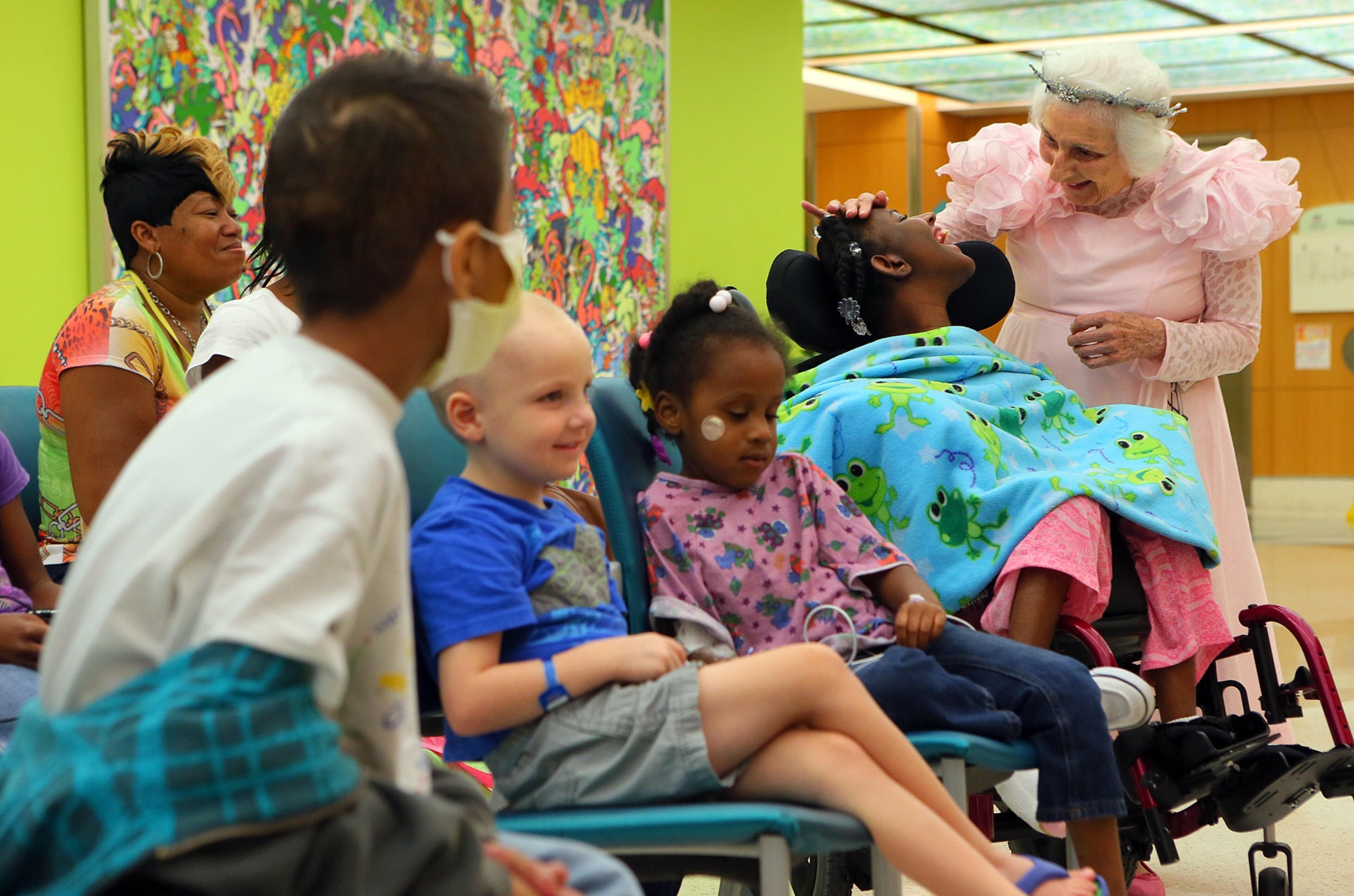 Mirclae Mitchell, 12, shares a smile with Viener at Children’s Healthcare of Atlanta’s story time, when children and parents are treated to a “magic hour,” during which “not a single child, not a single parent even thinks about the next chemo, the next shot, the next blood sample, the next procedure,” Viener says.