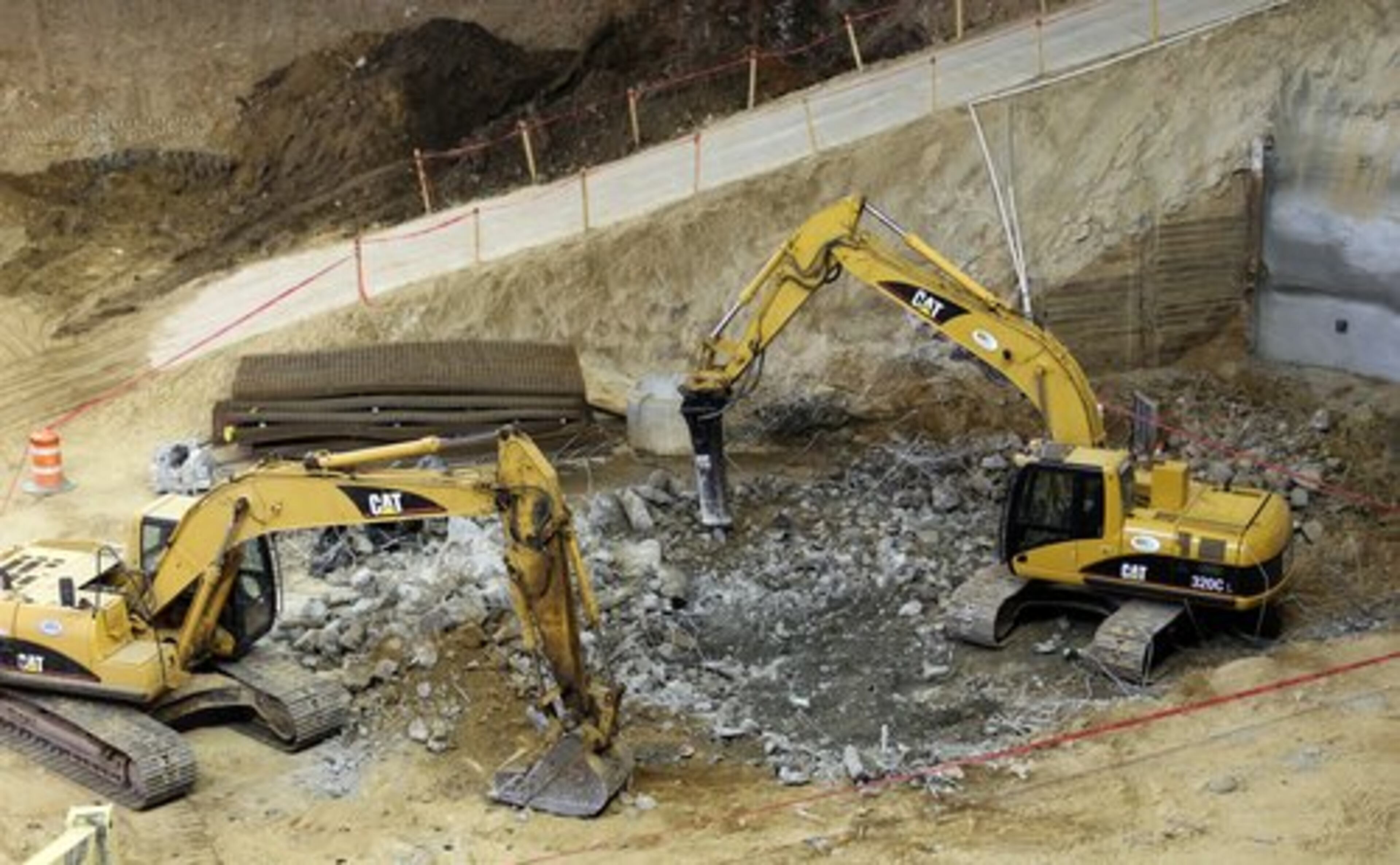 Construction equipment was used to demolish center court. The old floor will be used as a decorative feature in the new place.