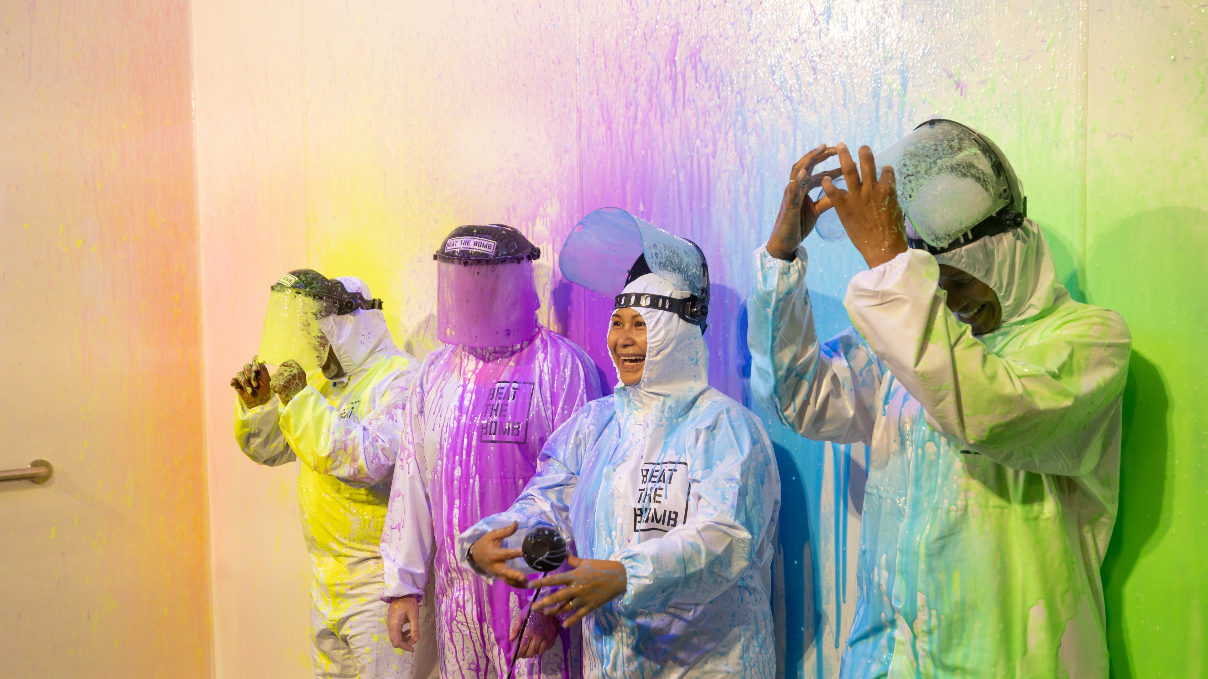 A team is splattered with paint at Beat the Bomb in Atlanta on Saturday, Oct. 15, 2022. The Brooklyn-based immersive escape room experience recently opened its Atlanta location. (Photo by Jenn Finch)