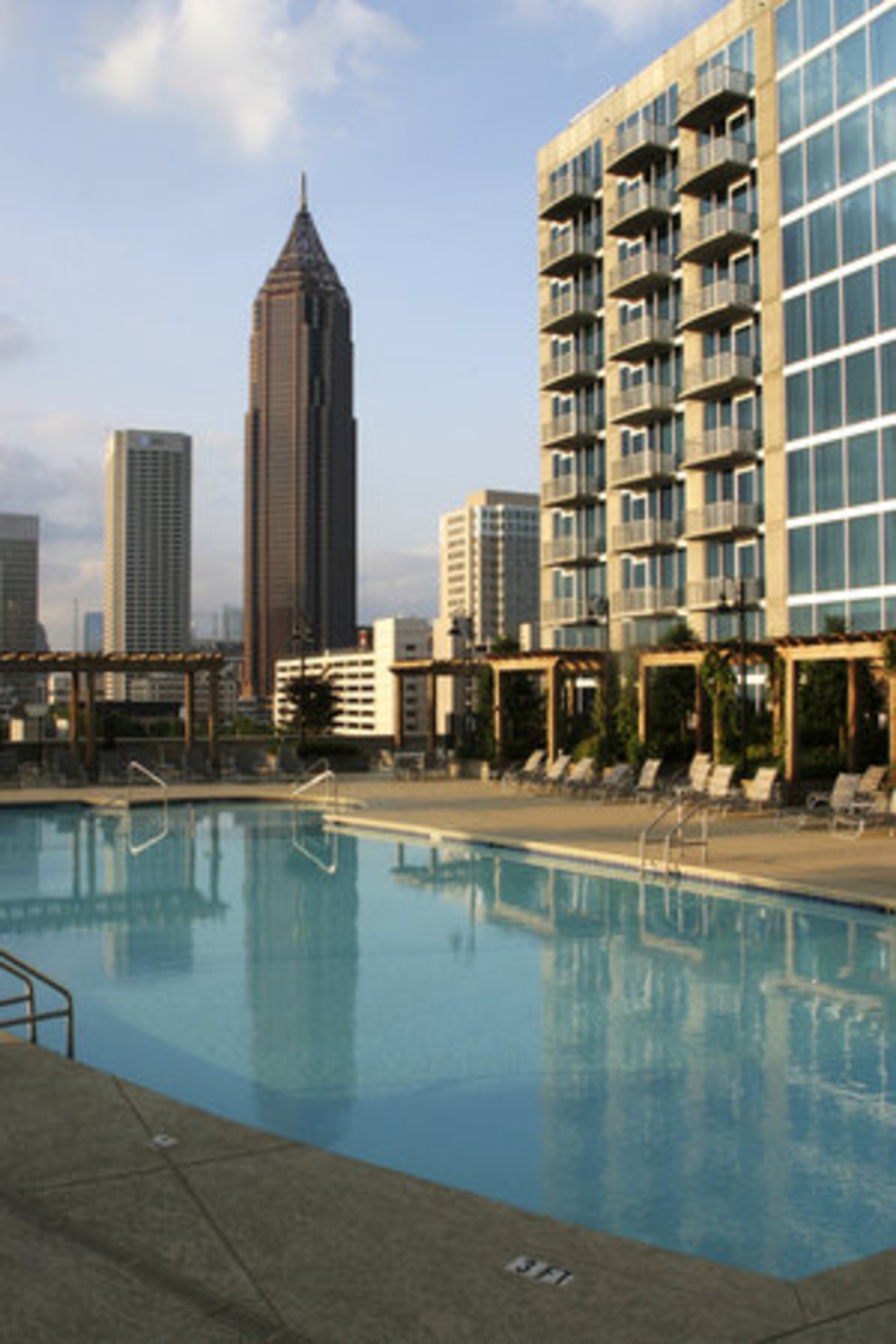 "We don't have any close friends as yet," shares Saif. "We tend to go out more than we entertain here," adds Miranda. The couple likes trying different types of cuisine, and eat out at least two to three times a week, trying new restaurants or places that people recommend. Pictured here is the pool for the residences at Twelve Centennial Park.