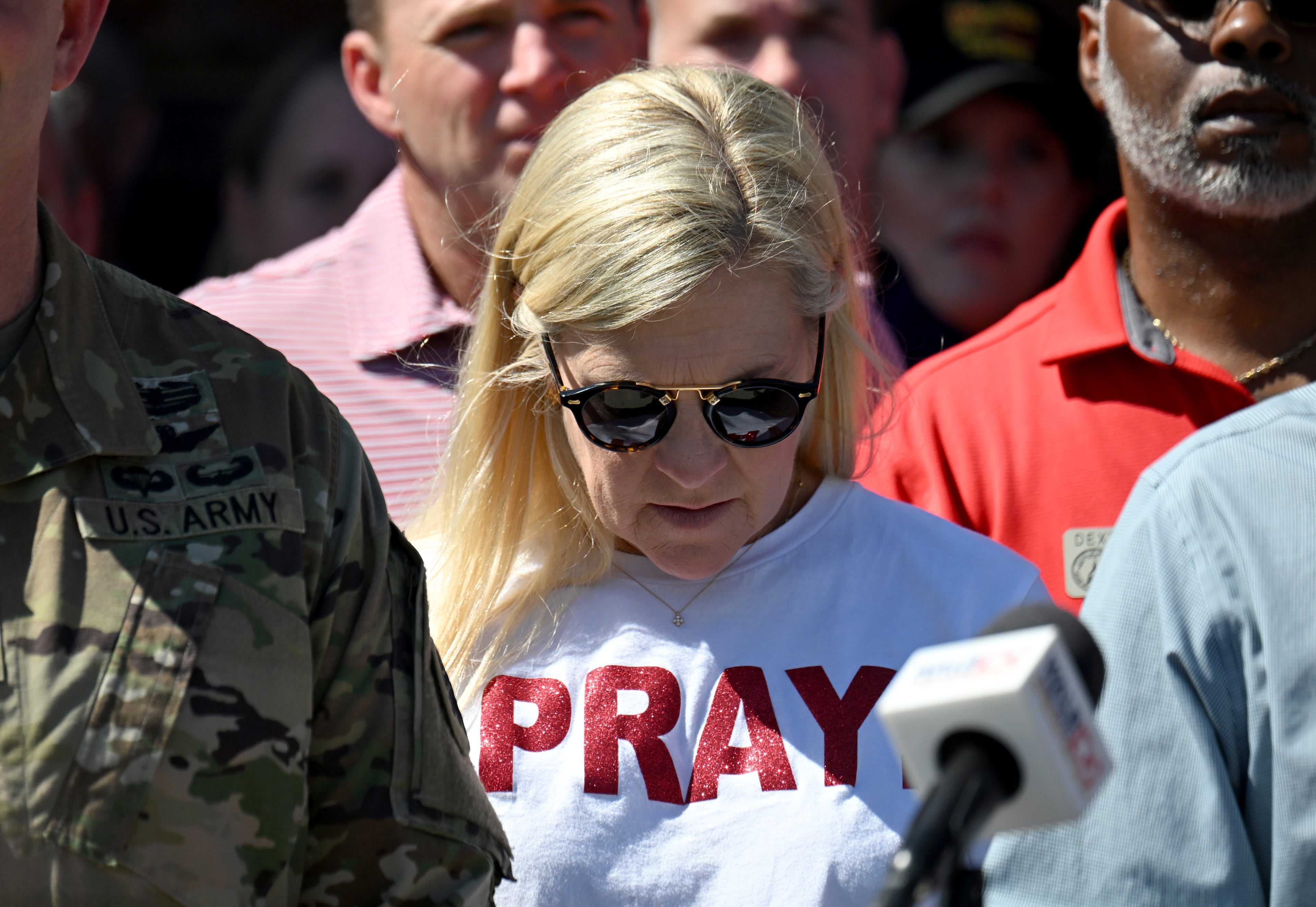 First Lady of Georgia Marty Kemp wears a T-shirt that reads “Pray” as Governor Brian Kemp (not pictured) speaks at Lowndes County Emergency Management Operations Center, Saturday, September 28, 2024 in Valdosta. Damaging Helene has swept through Georgia, leading to at least 15 deaths. All 159 counties are now assessing the devastation and working to rebuild, even as serious flooding risks linger. (Hyosub Shin / AJC)