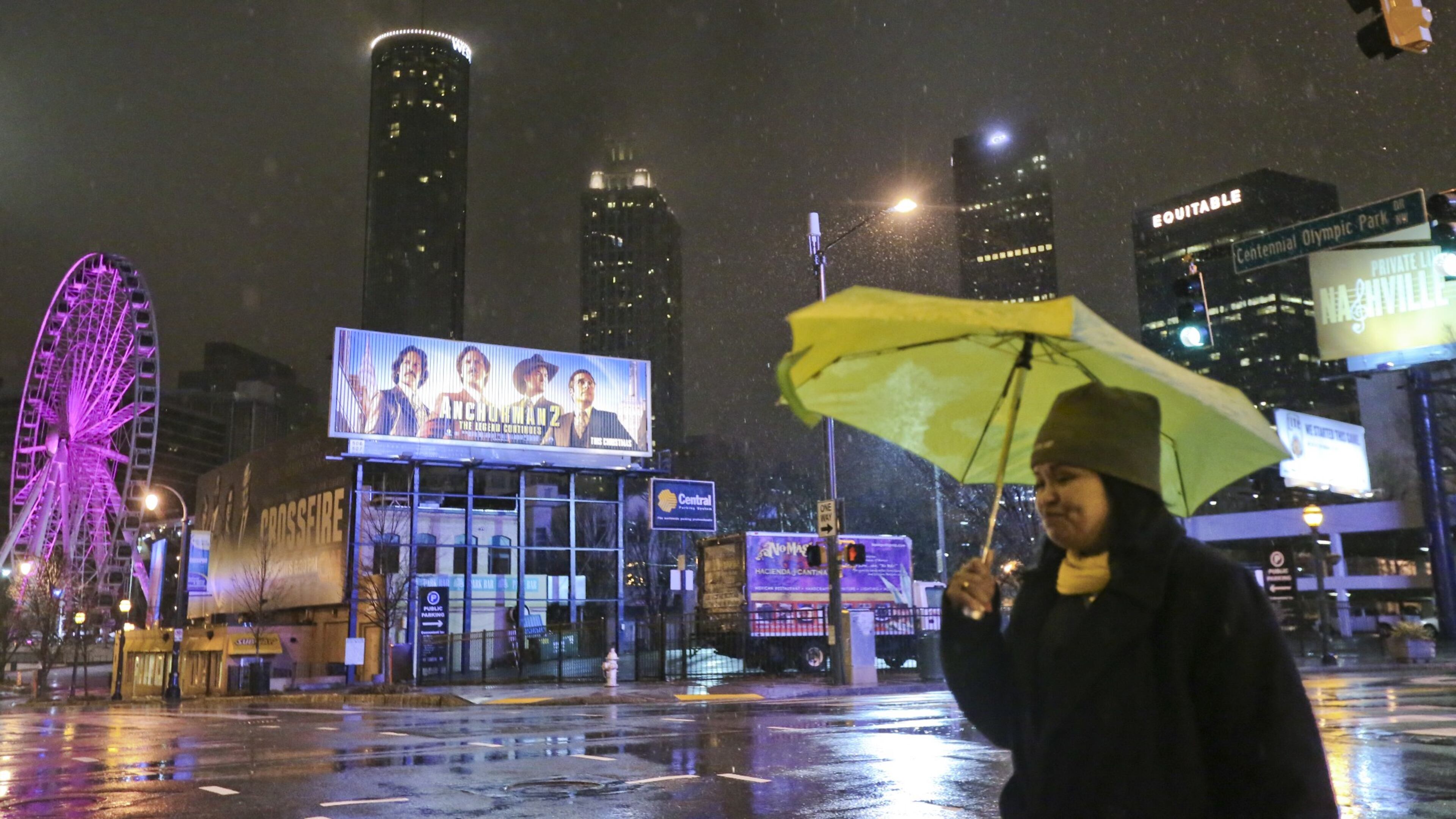 Maria Foster had no ice worries as she walked along Marietta Street in downtown Atlanta Tuesday, Feb. 11, 2014.