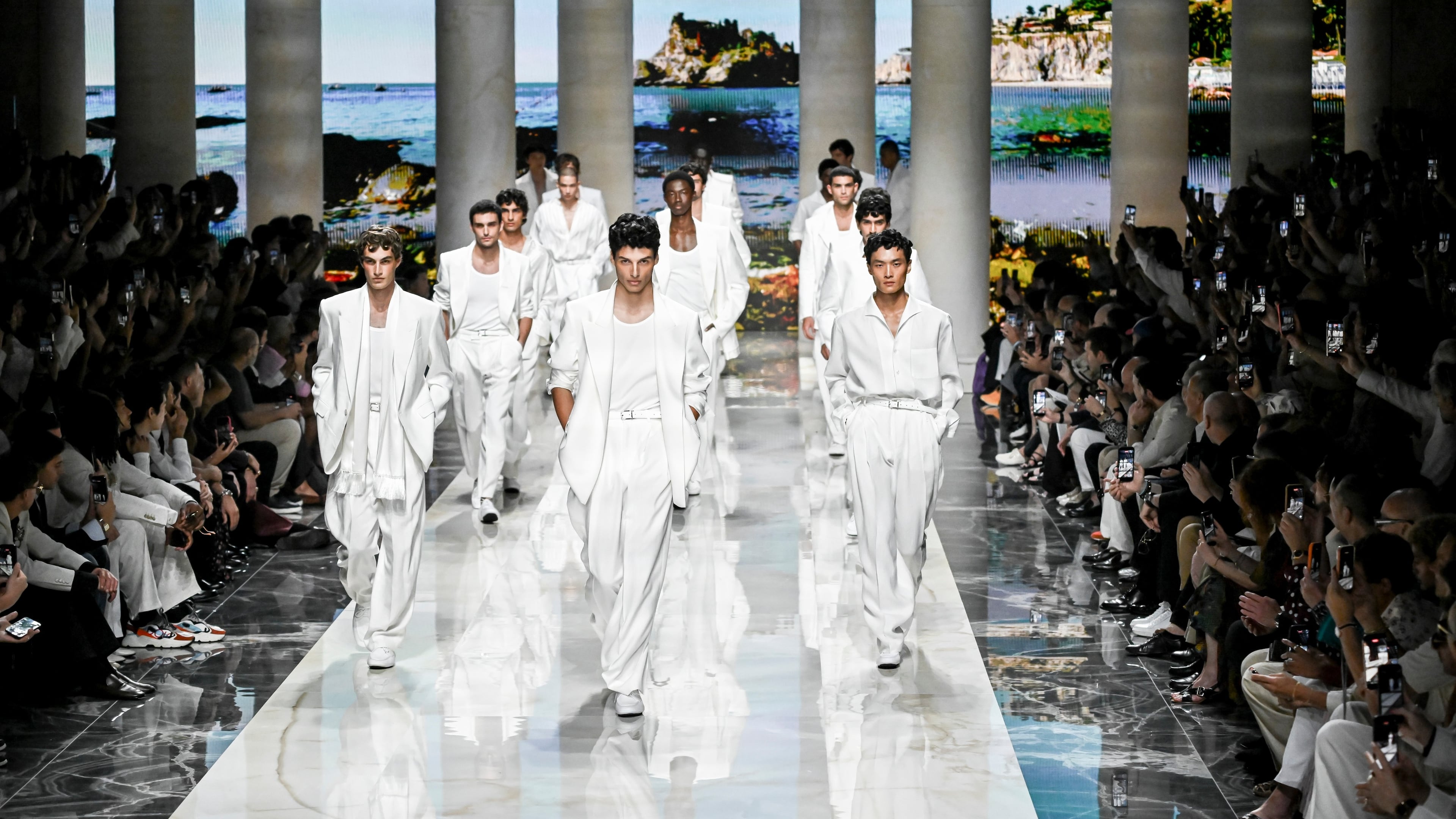 Models wear creations from the Dolce & Gabbana Spring/Summer 2027 Men's collection presented in Milan, Italy, Saturday, June 20, 2026. (AP Photo/Nicola Marfisi)