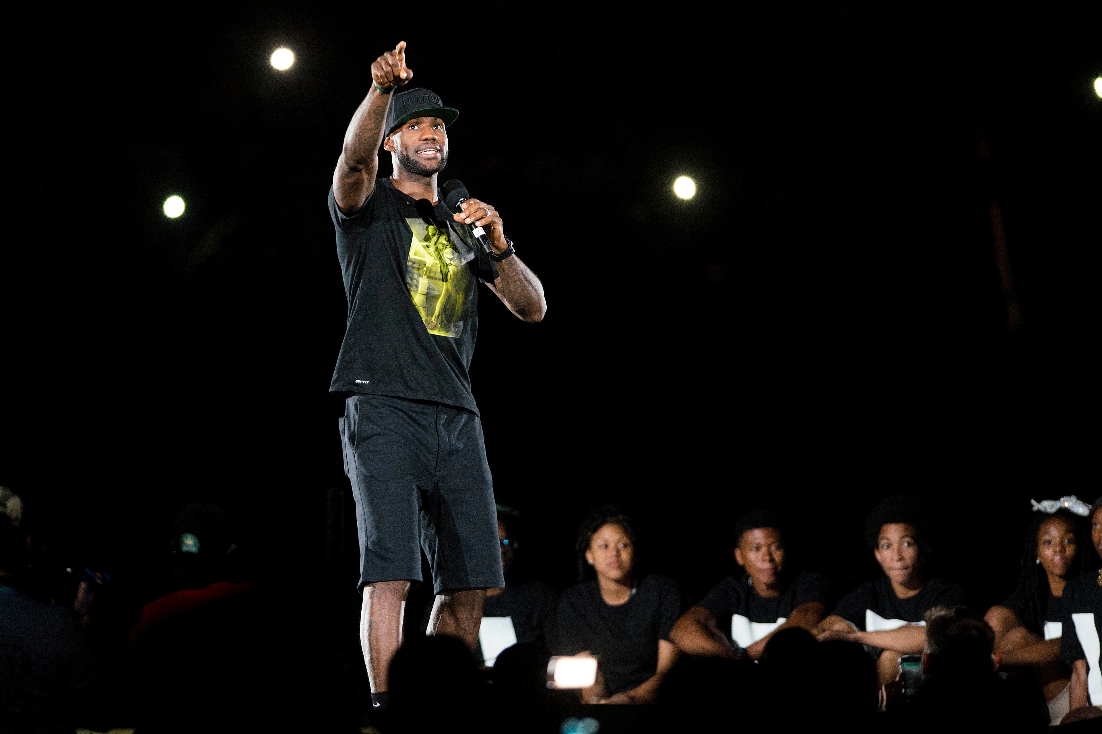 LeBron James speaks to his fans in the city of Akron after taking the stage during his Welcome Home Ceremony at Infocision Stadium at the University of Akron on August 8, 2014 in Akron, Ohio. (Photo by Ty Wright/Getty Images)