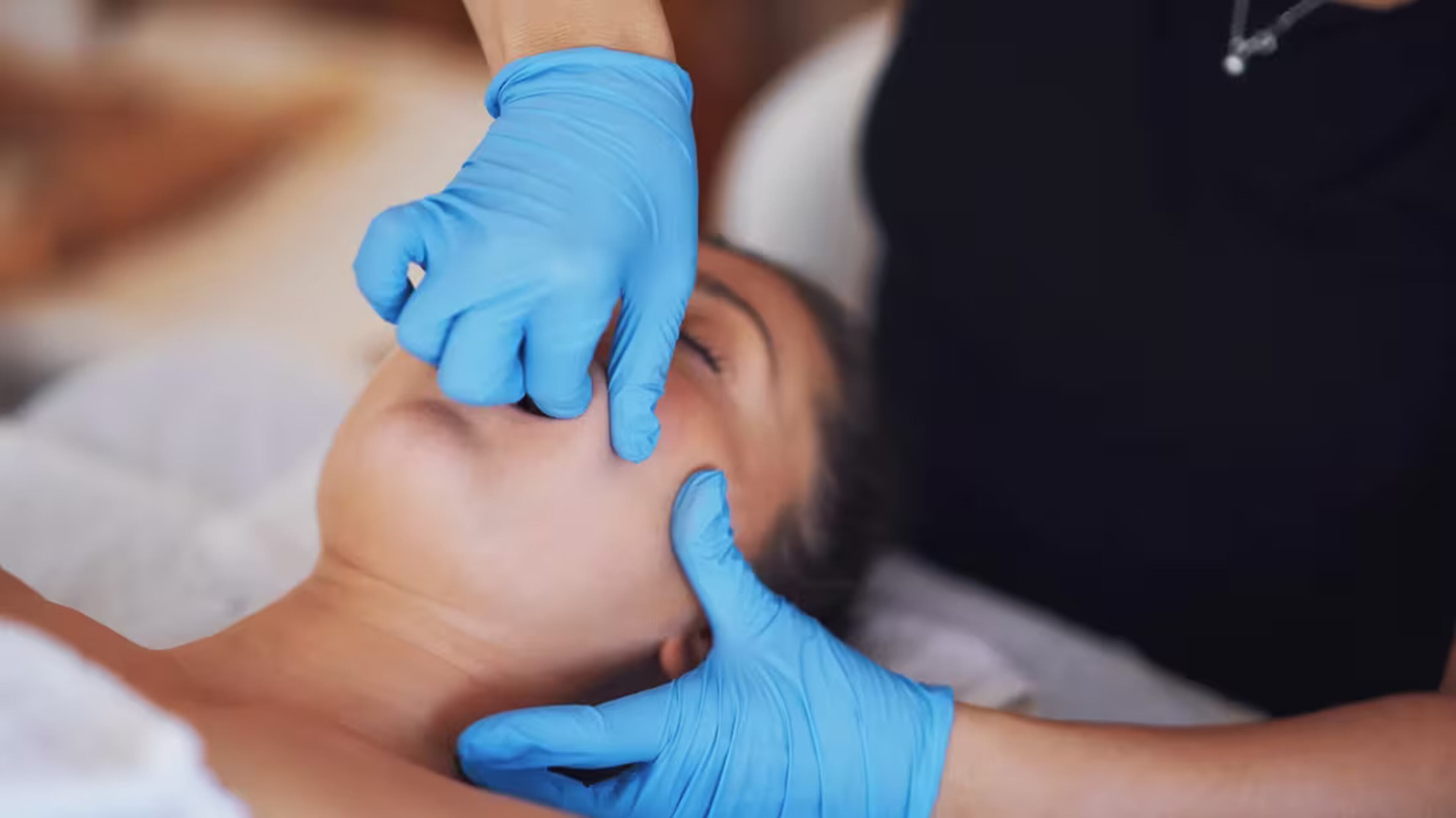 Intense intra-oral treatment, known as TMJ therapy, is when a practitioner works inside the mouth to release pain and tension in the jaw muscle. (Courtesy of Cleveland Clinic)