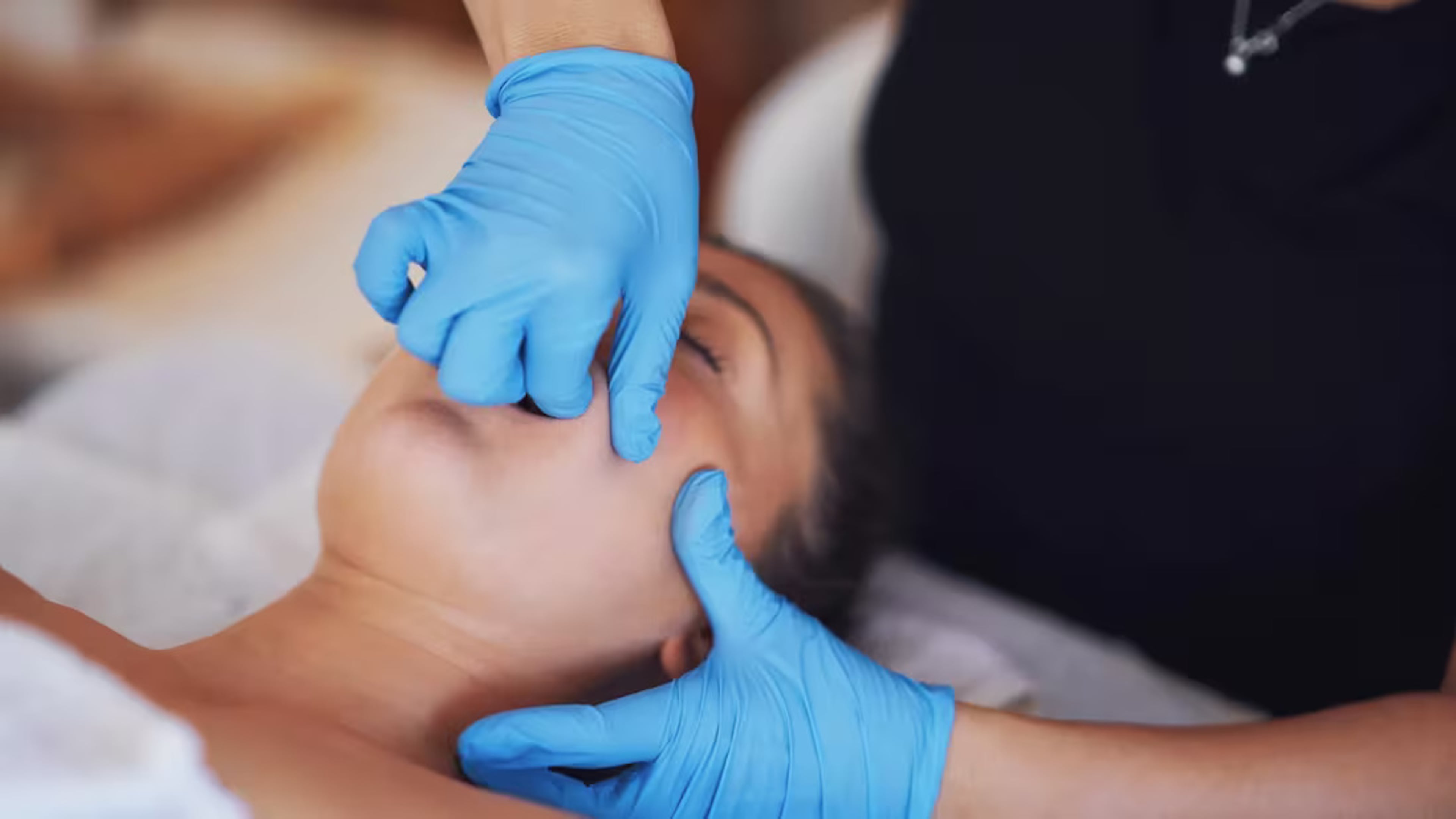Intense intra-oral treatment, known as TMJ therapy, is when a practitioner works inside the mouth to release pain and tension in the jaw muscle. (Courtesy of Cleveland Clinic)